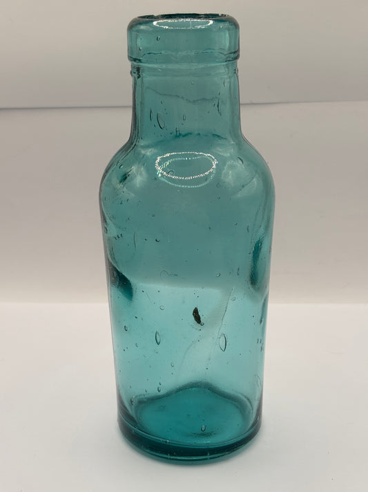 Old dark aqua glass jar
