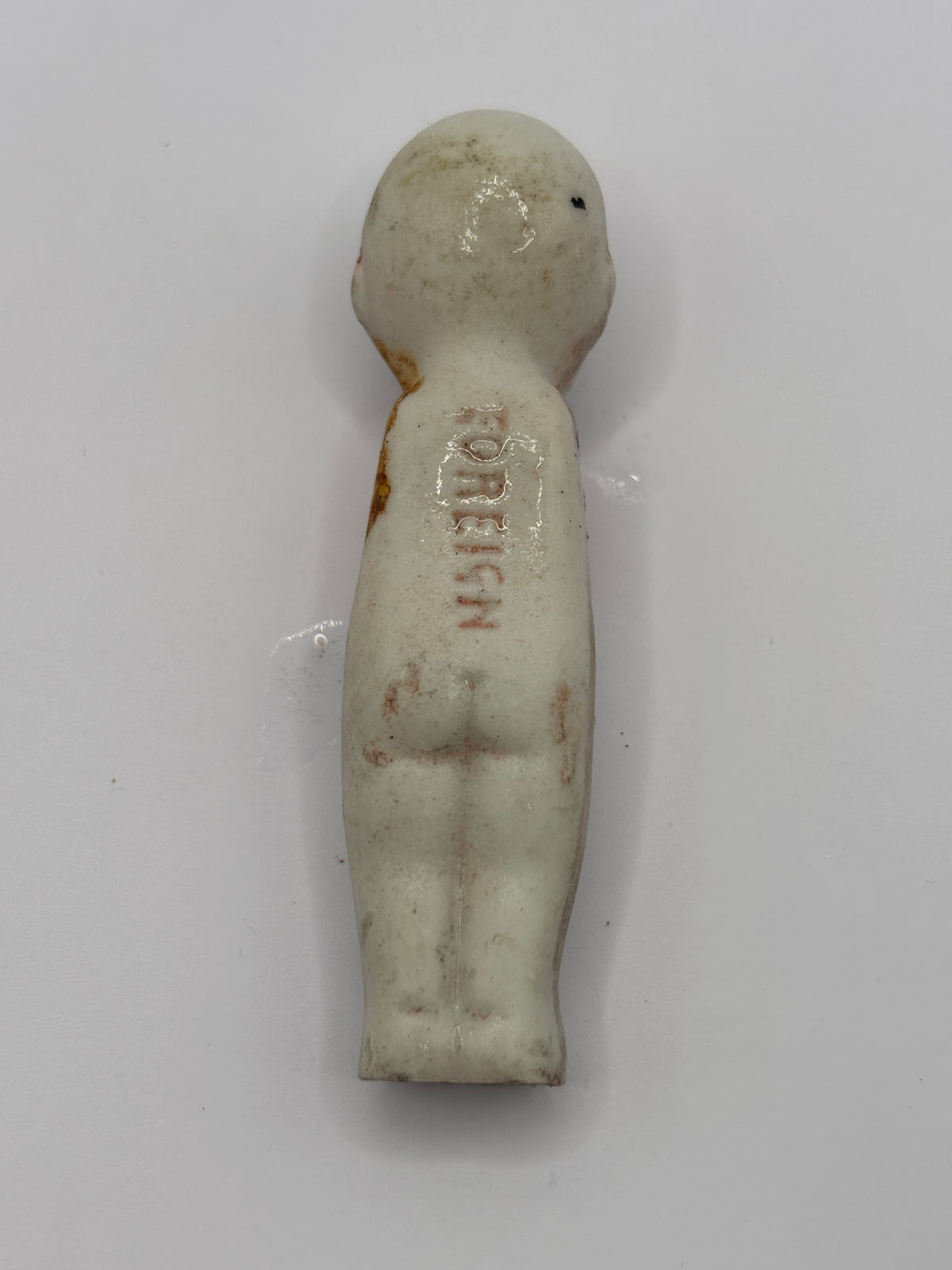 Old crusty small doll, armless