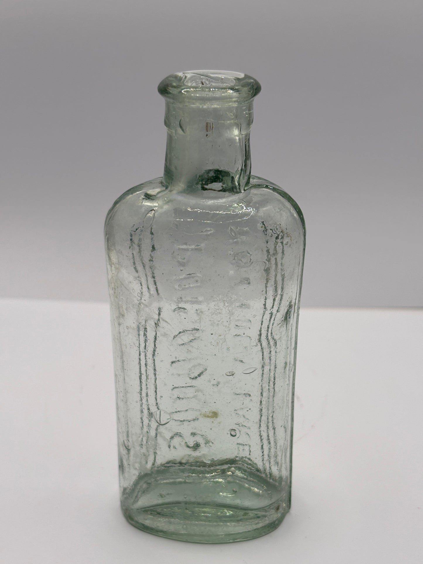 Old aqua glass poison bottle, Poisonous
