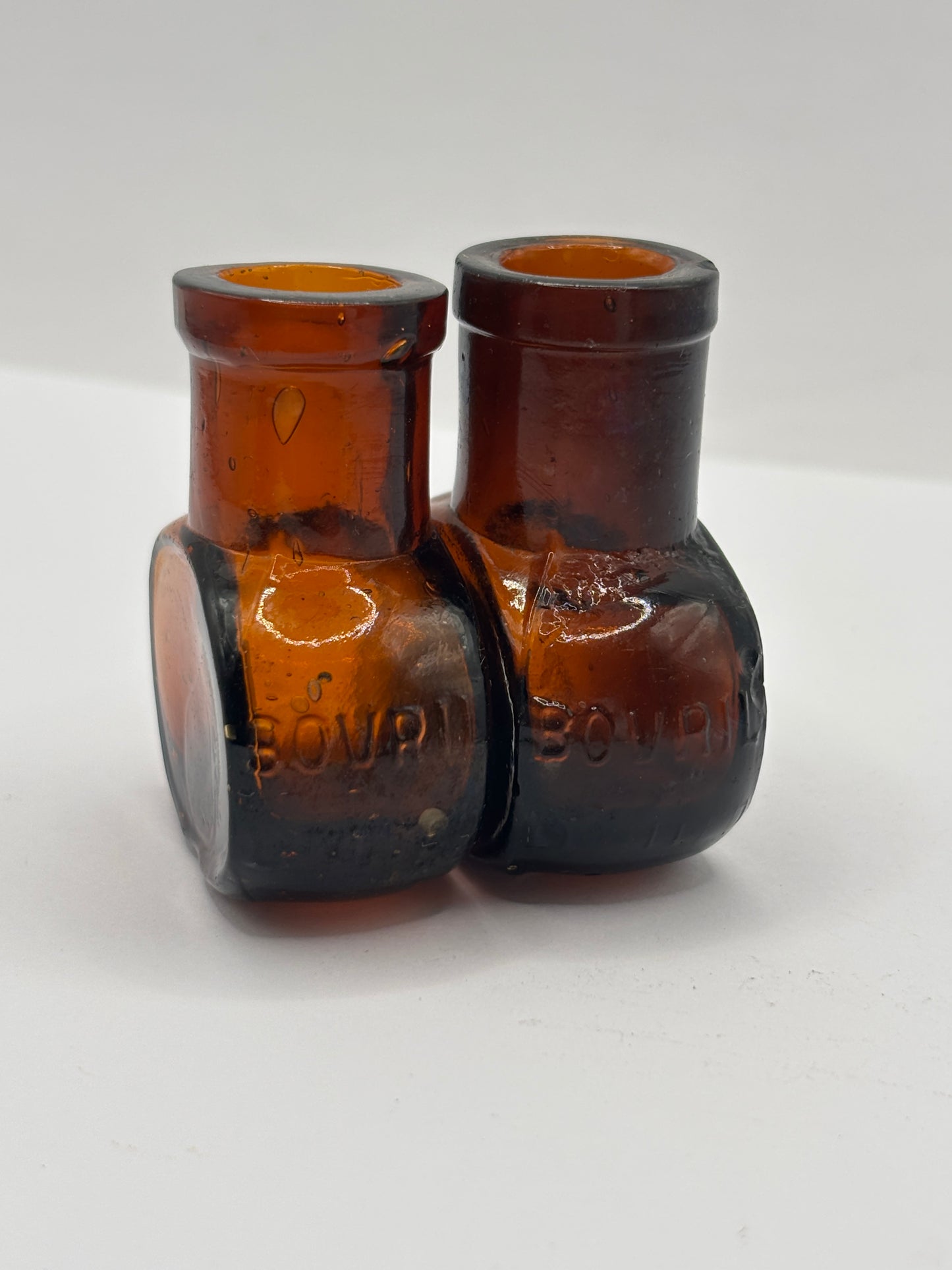 2 old mini bovril bottles
