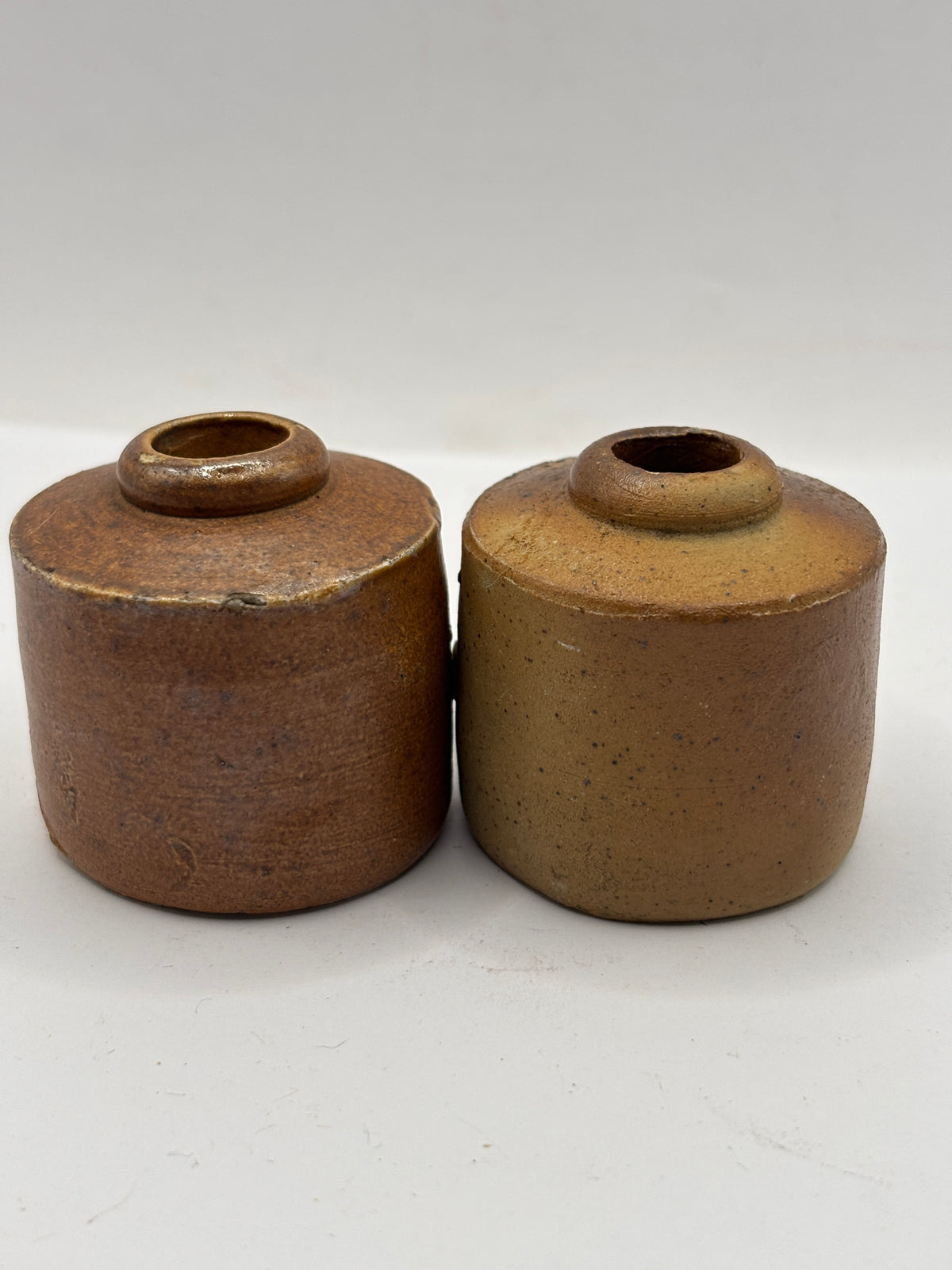 2 Old stoneware ink bottles, inkwells, pork pies