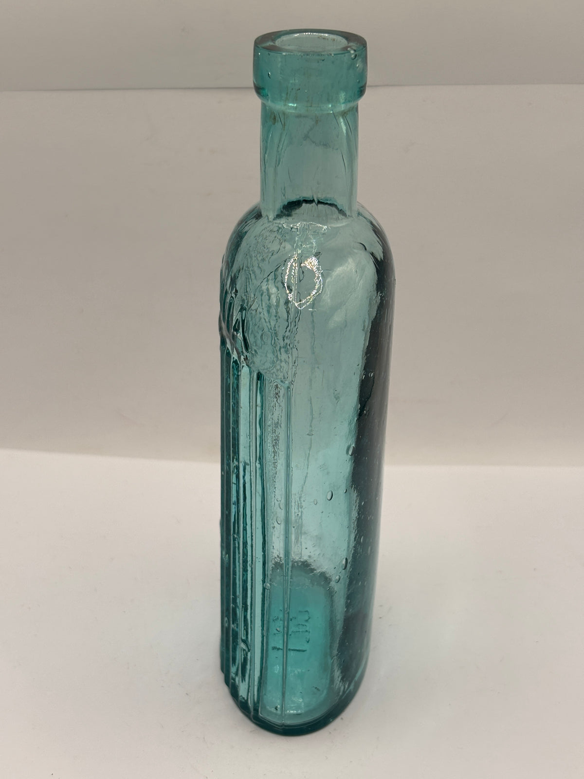 Old aqua glass poison bottle, ammonia, POISONOUS not to be taken