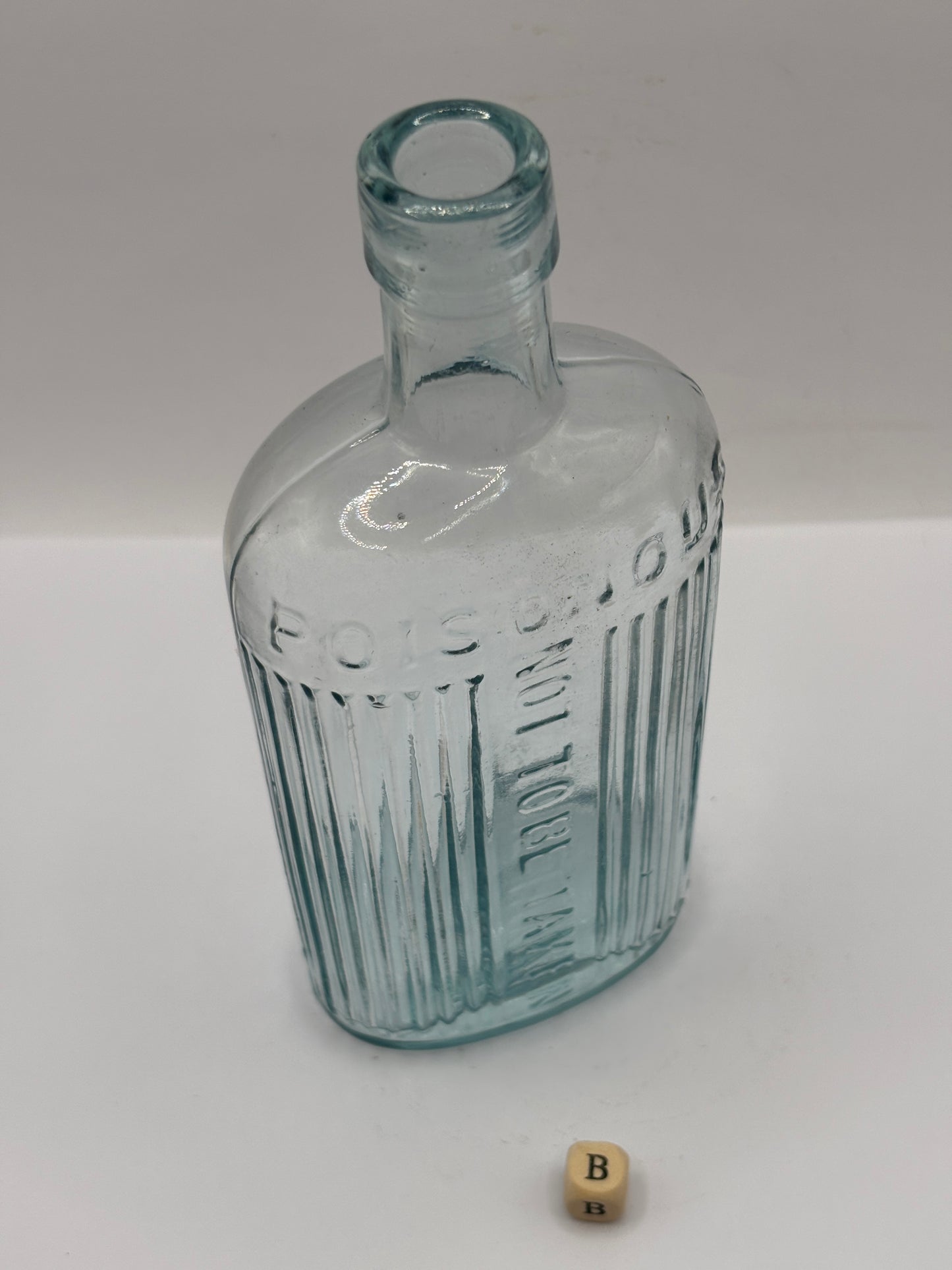 old aqua glass poison bottle, POISONOUS not to be taken (B)