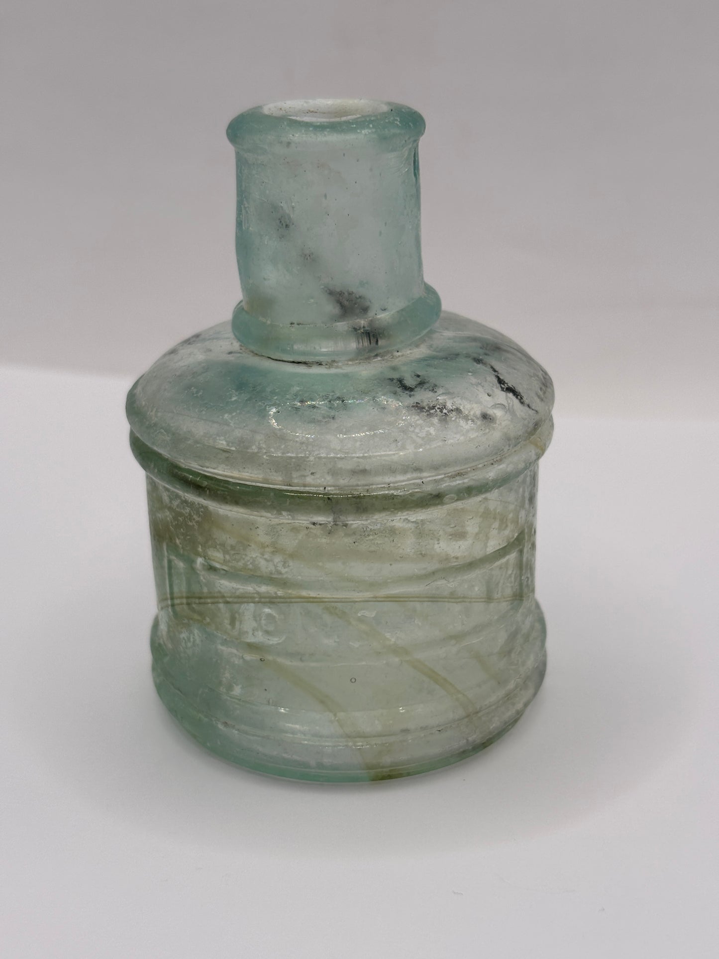 Old advertising inkwell,ink bottle. Lyons ink. Swirly