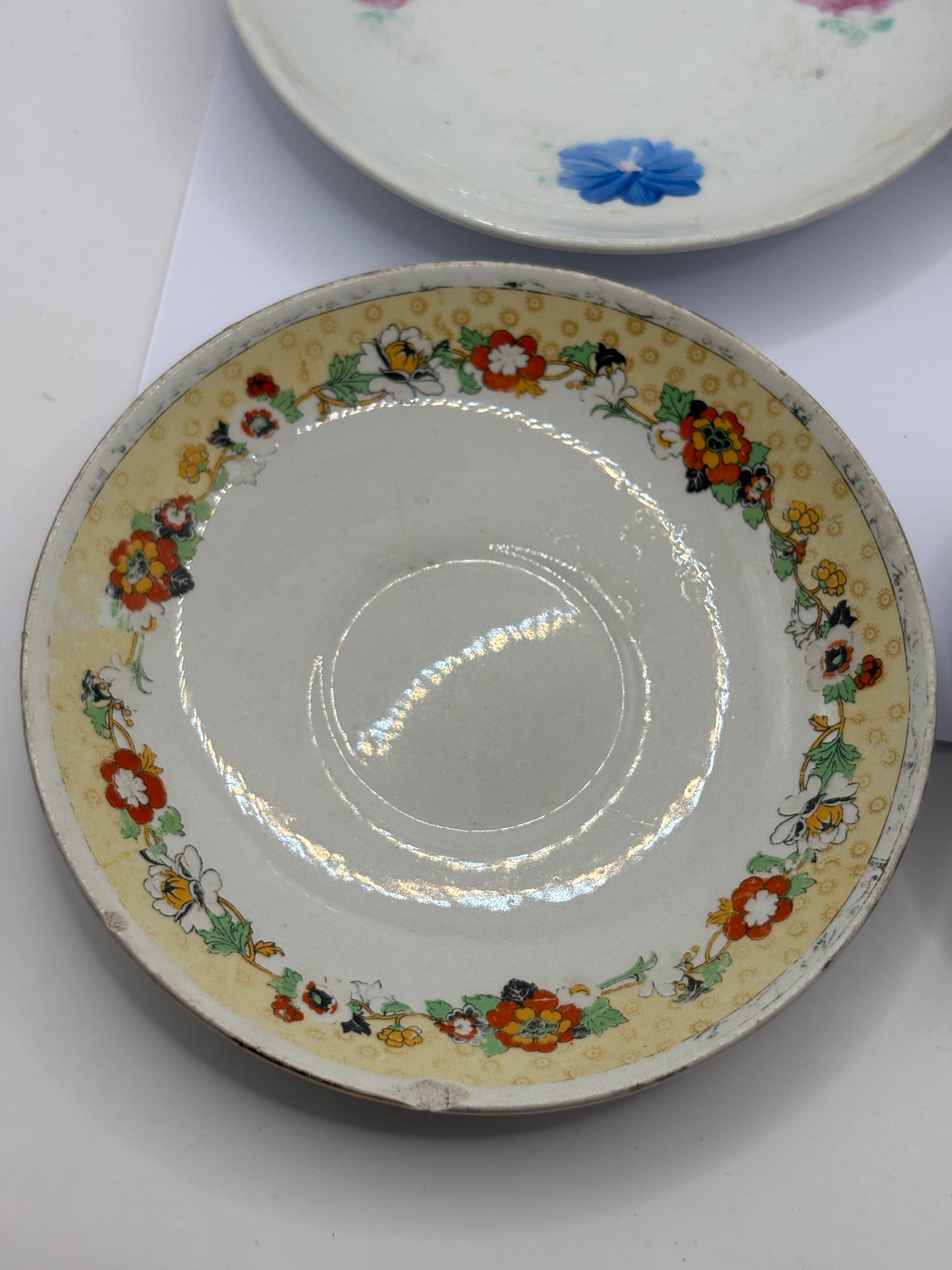 4 old decorative saucers (all dump dug)