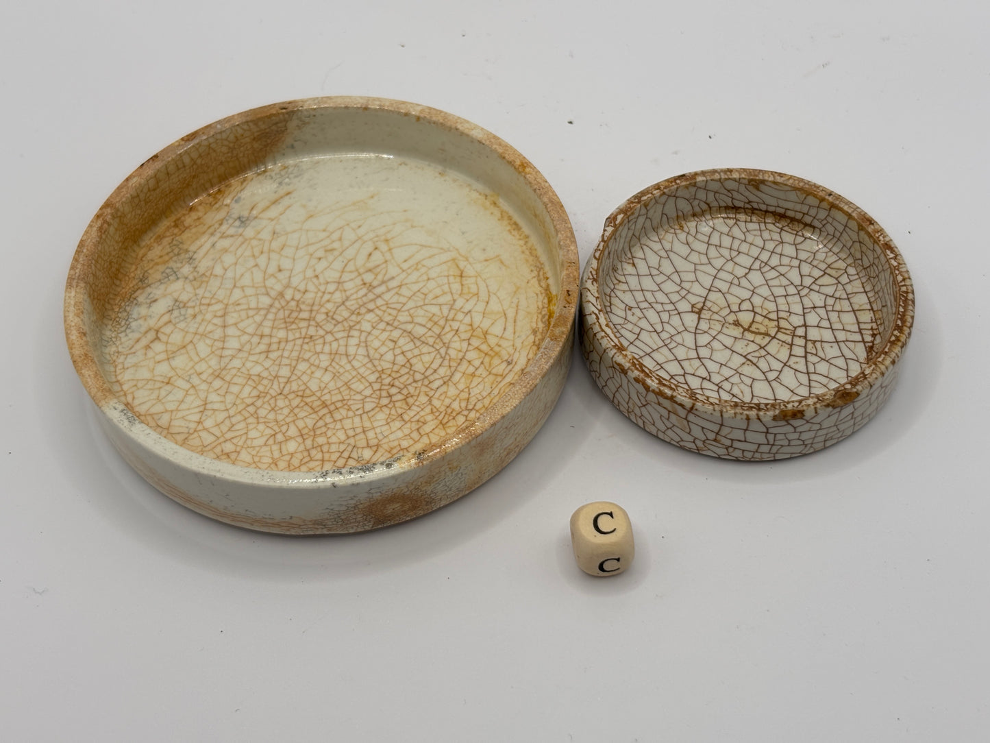 2 old stained & crazed stoneware lids