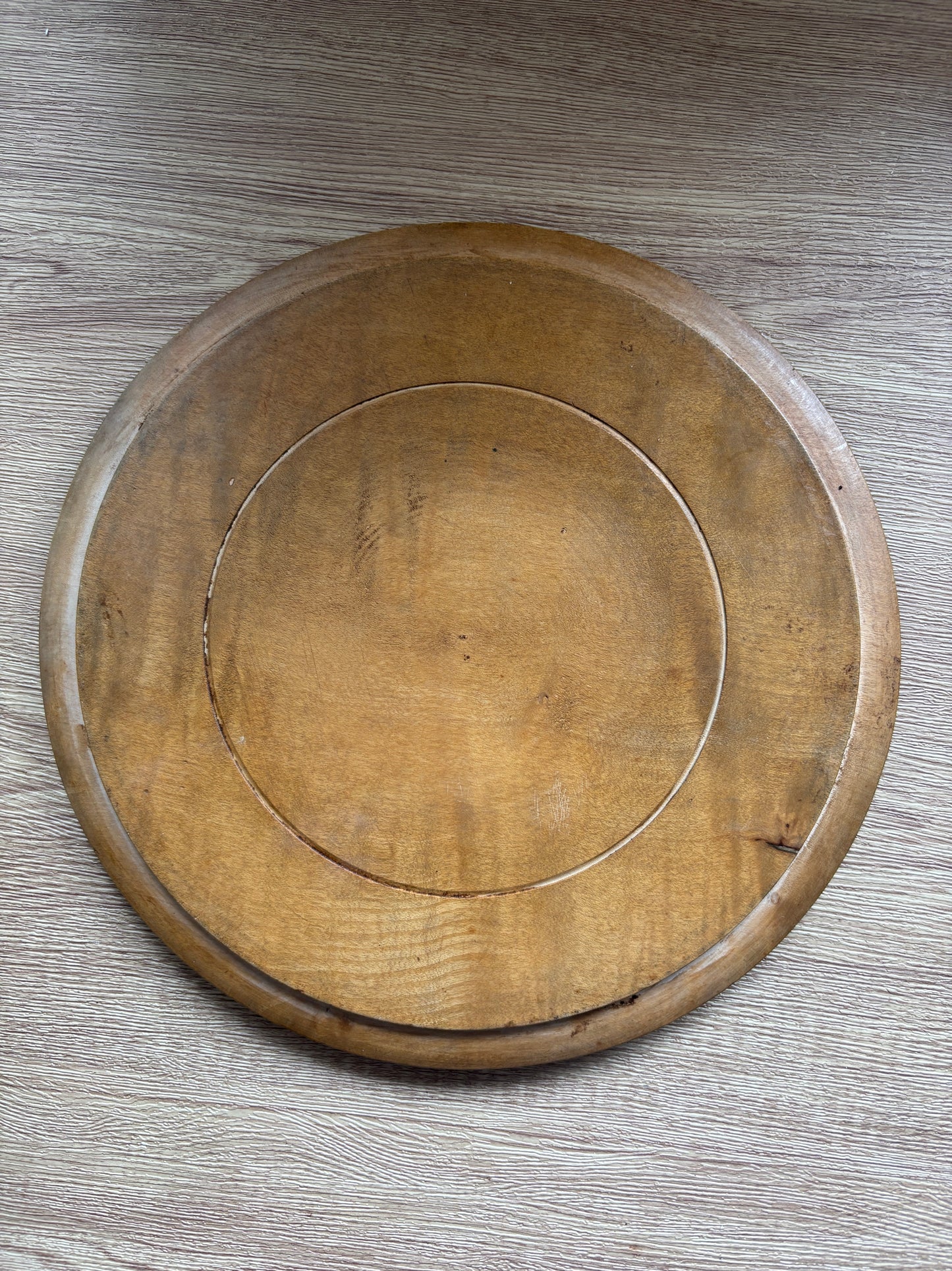 Old wooden carved bread board