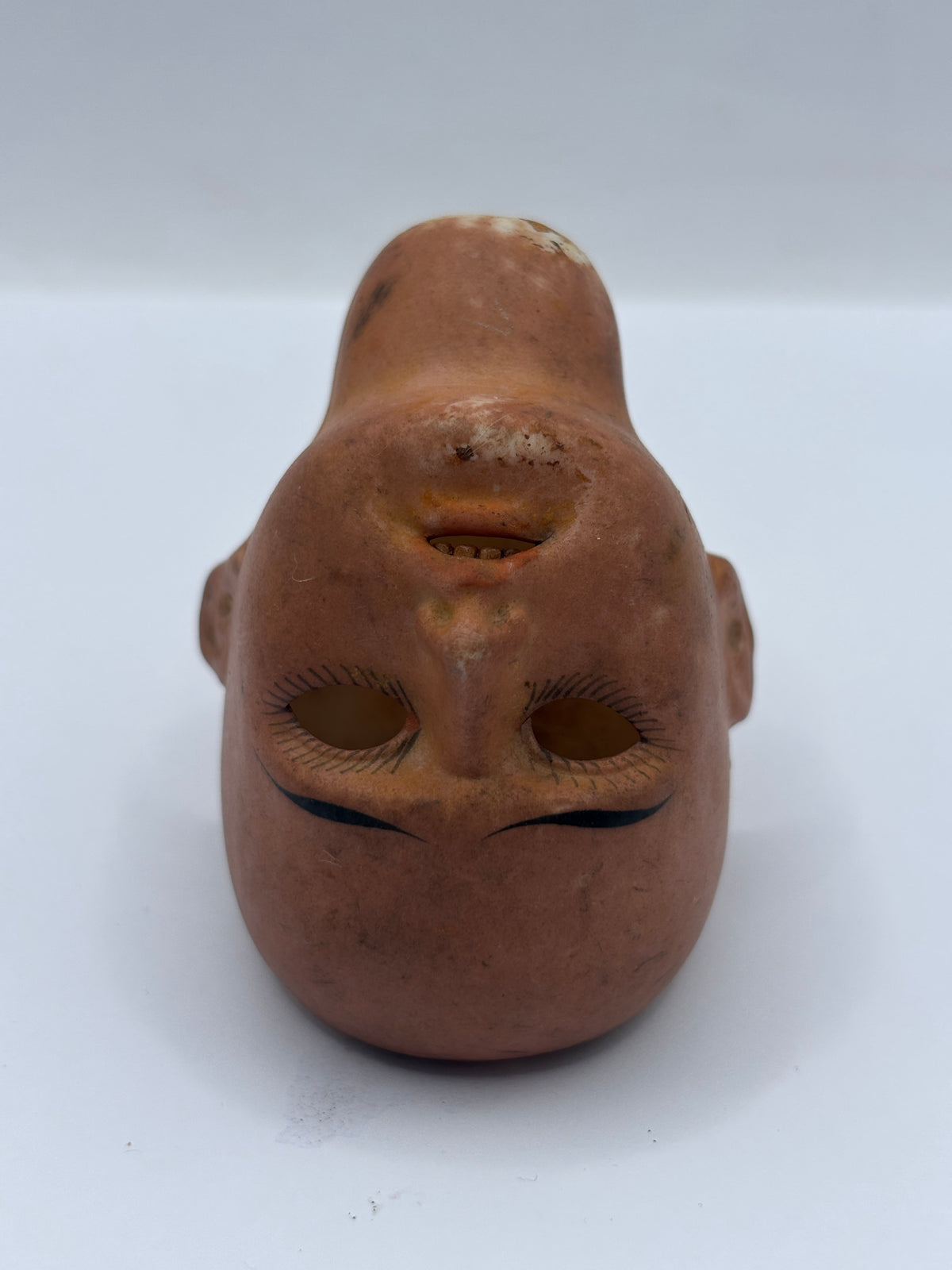 Old bisque dolls head, super stained