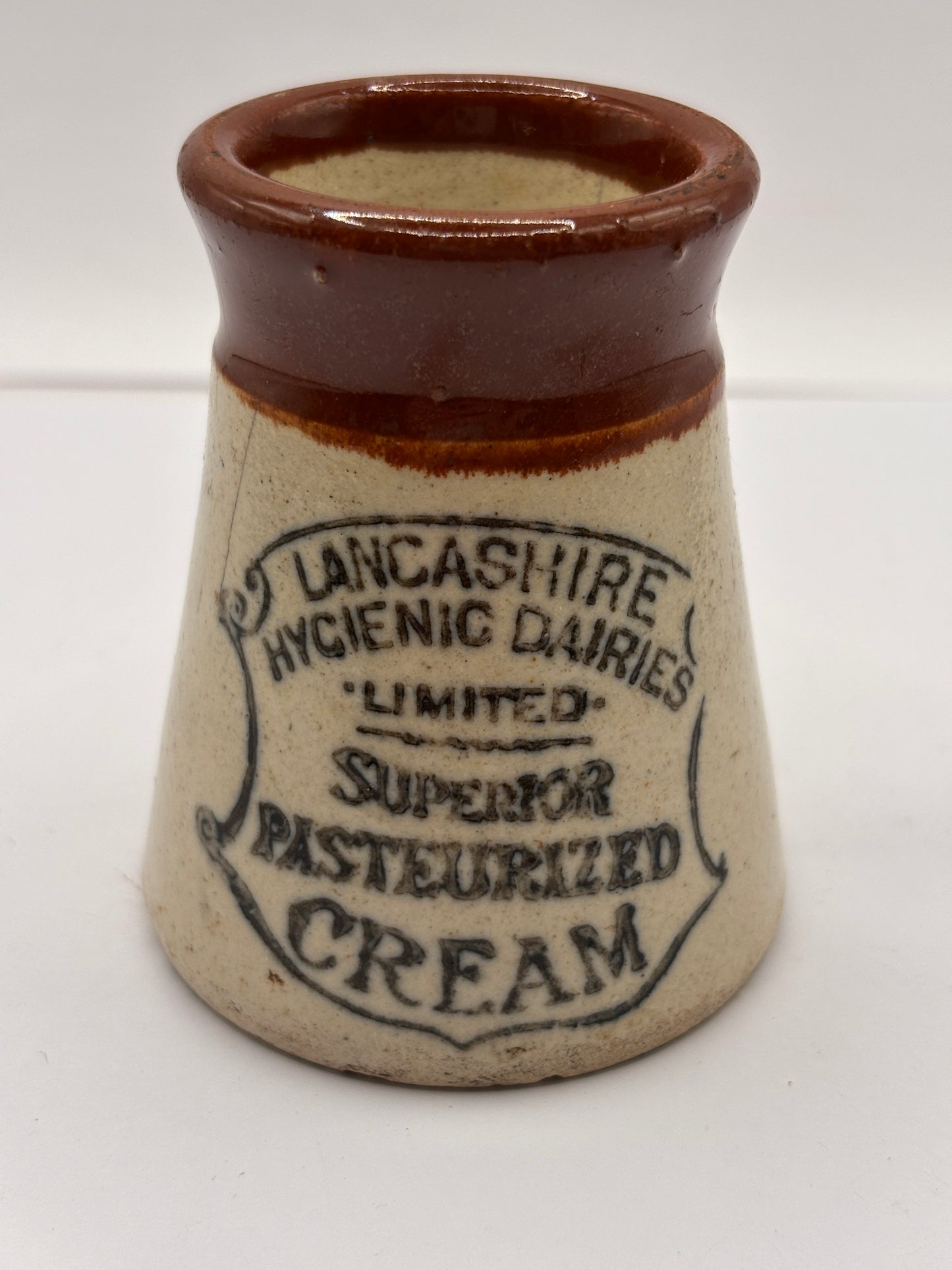 Old stoneware advertising cream pot, Lancashire hygienic dairies. Hairlines