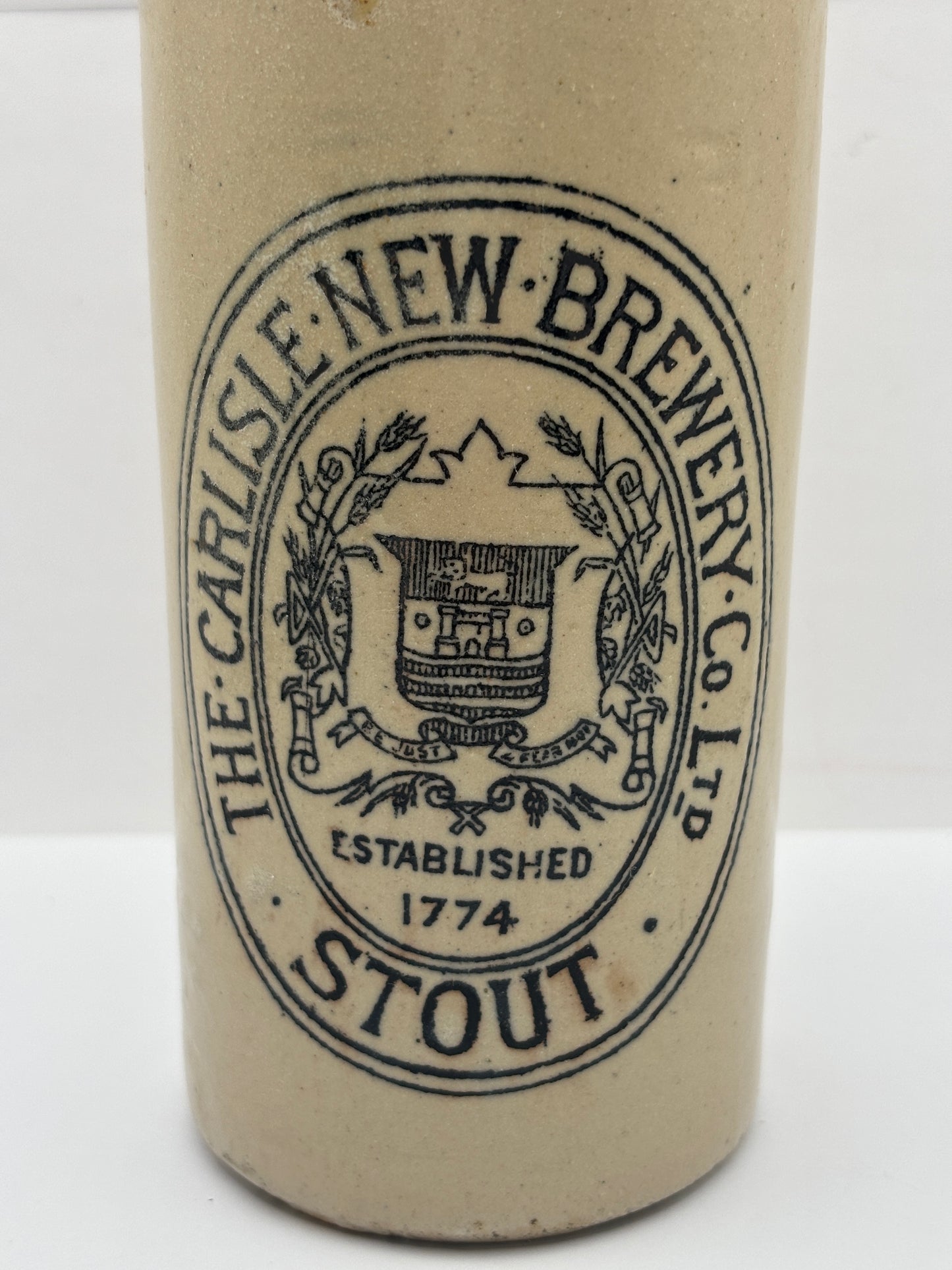 Old stoneware stout bottle, The Carlisle new brewery