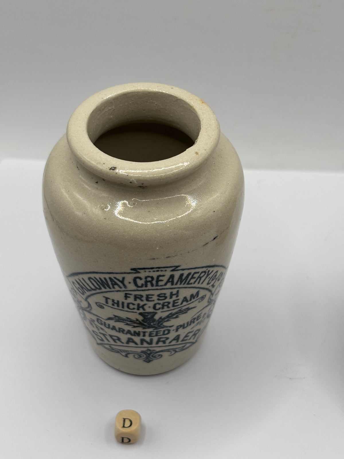 Old advertising cream pot, Galloway creamery Stranraer. Lip chip (D)