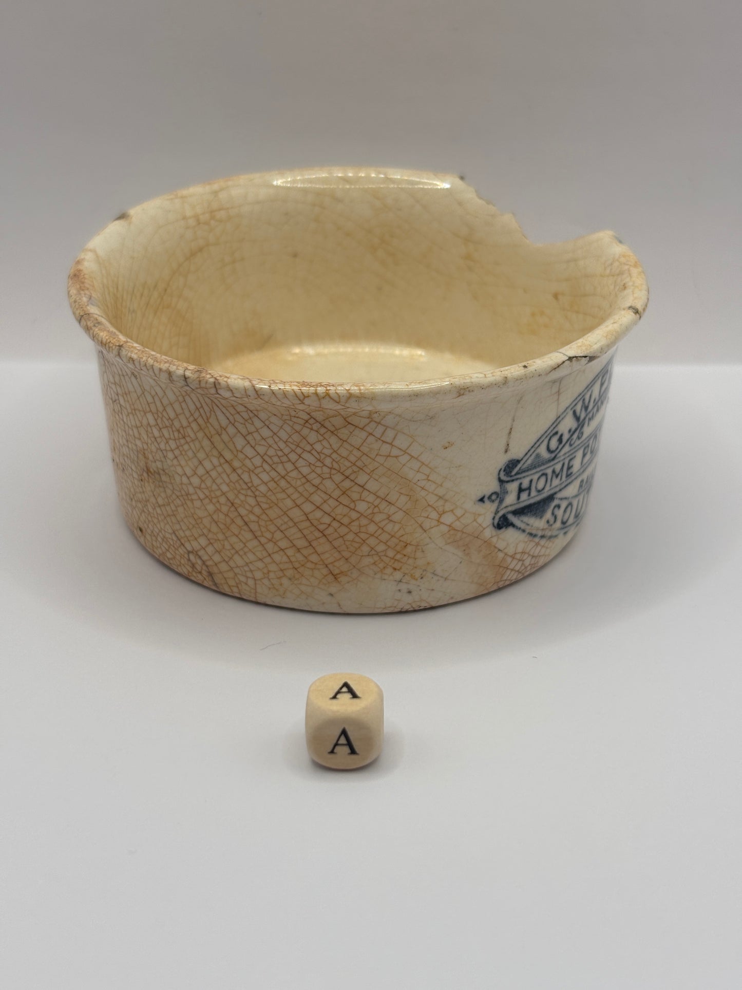 Old advertising meat paste pot, plumtrees (a) damaged