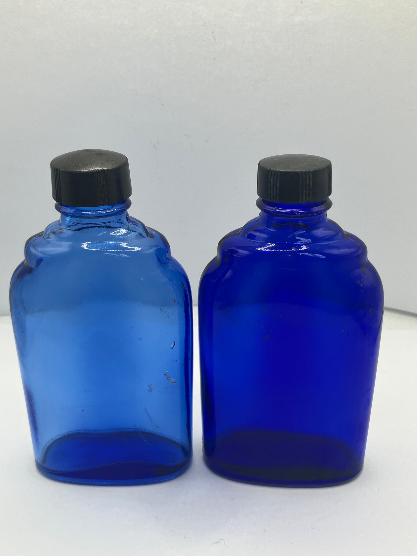 2 blue glass optrex bottles