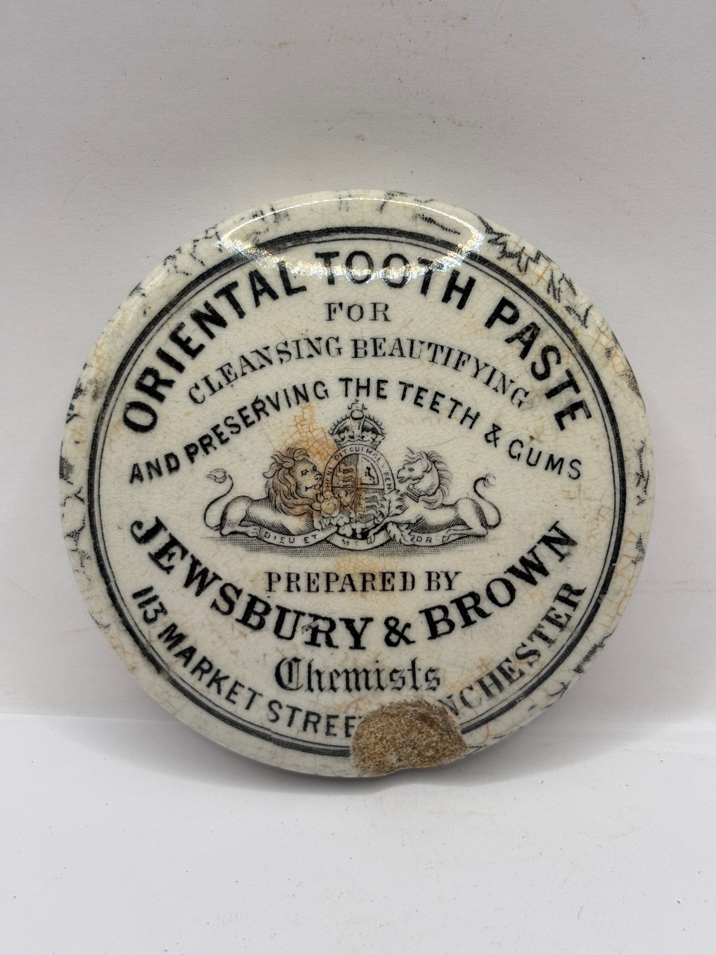 Old advertising lid, Jewsbury & brown oriental tooth paste. Damaged