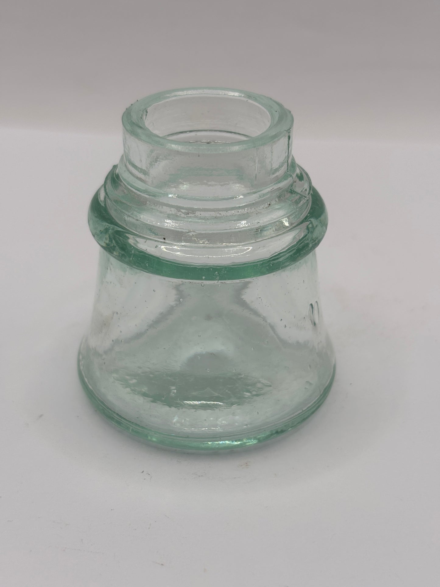 Old aqua glass inkwell. Ink bottle