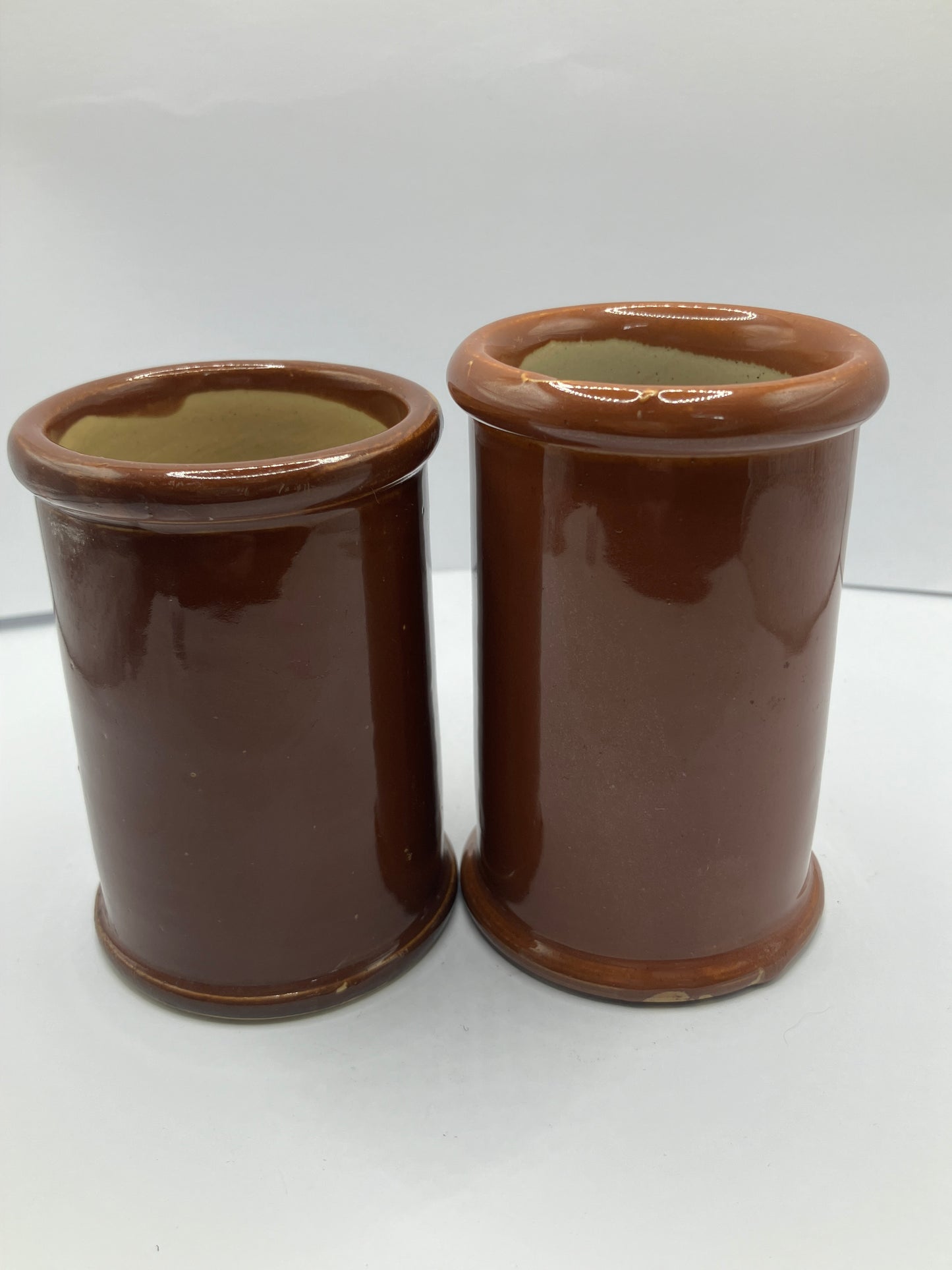 2 brown stoneware cream pots