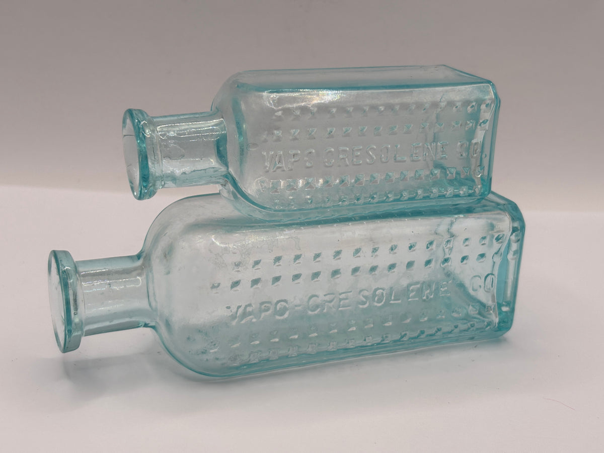 2 aqua glass bottles, Vapo-cresolene co