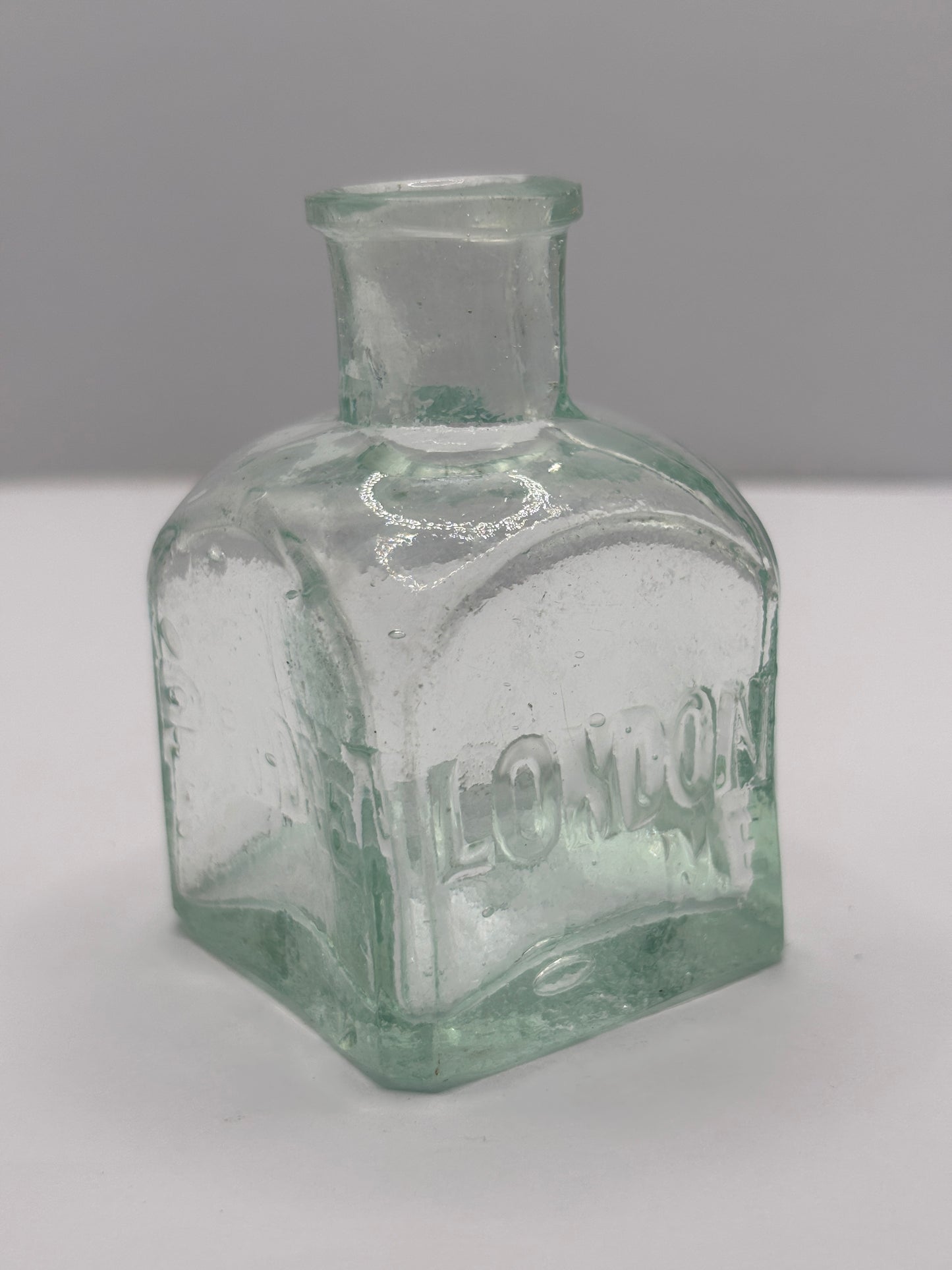 Old aqua glass advertising inkwell, ink bottle. Pridge