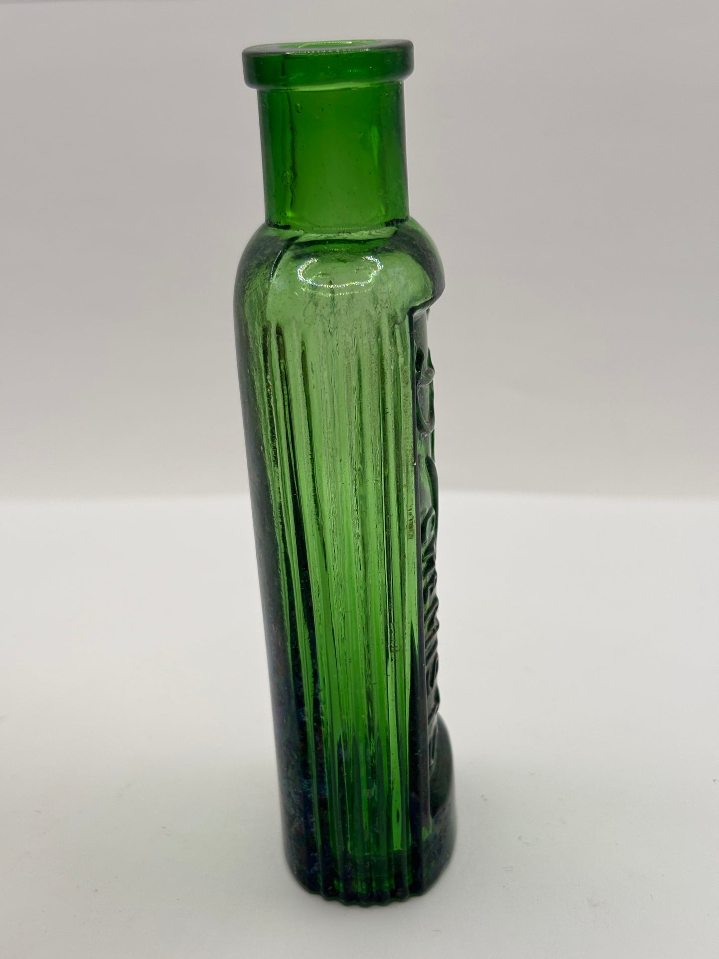 Old green glass advertising bottle. Boots Cash Chemists
