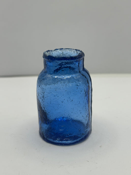 Small blue rat paste bottle