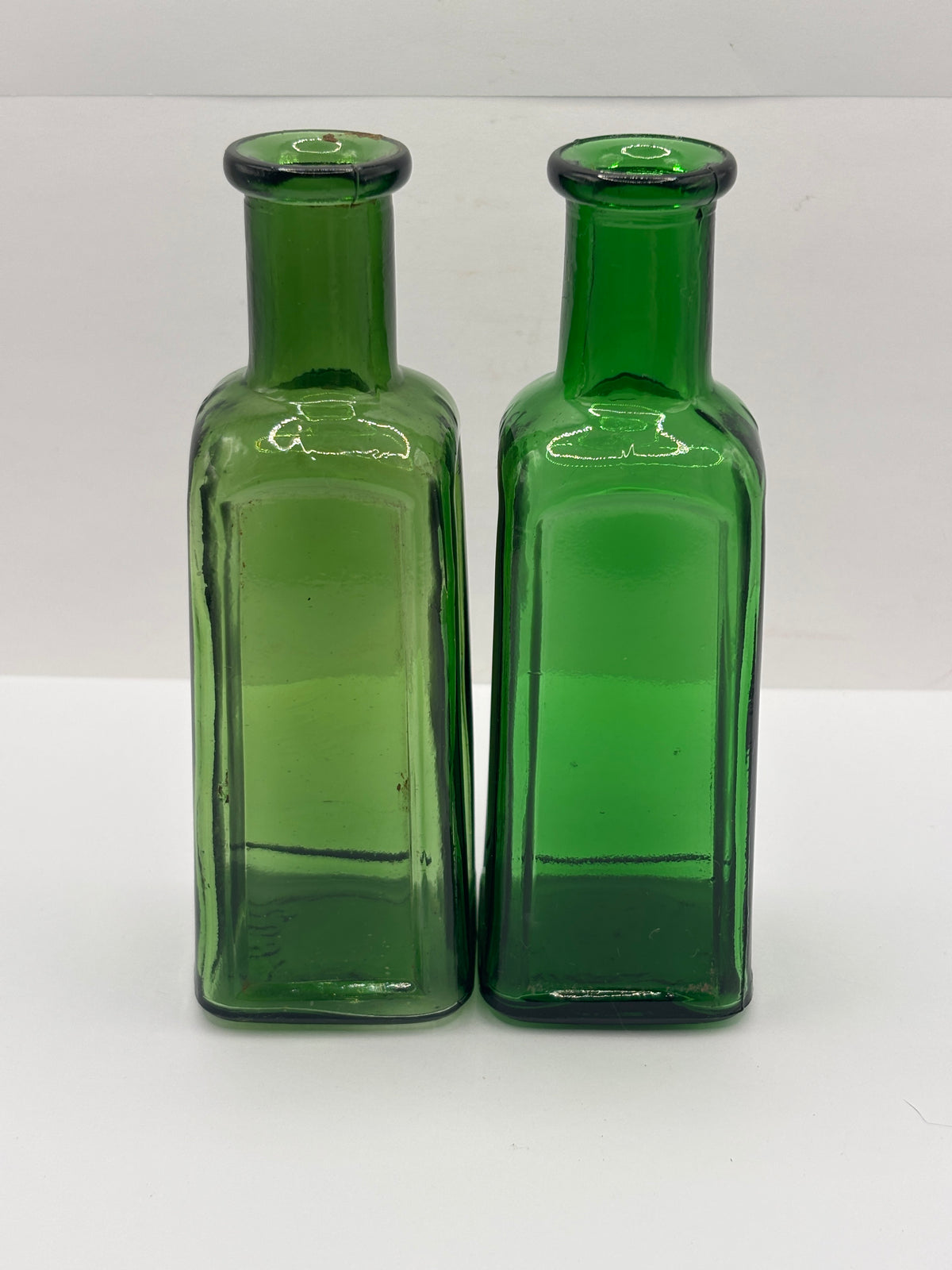 2 old green glass IZAL bottles