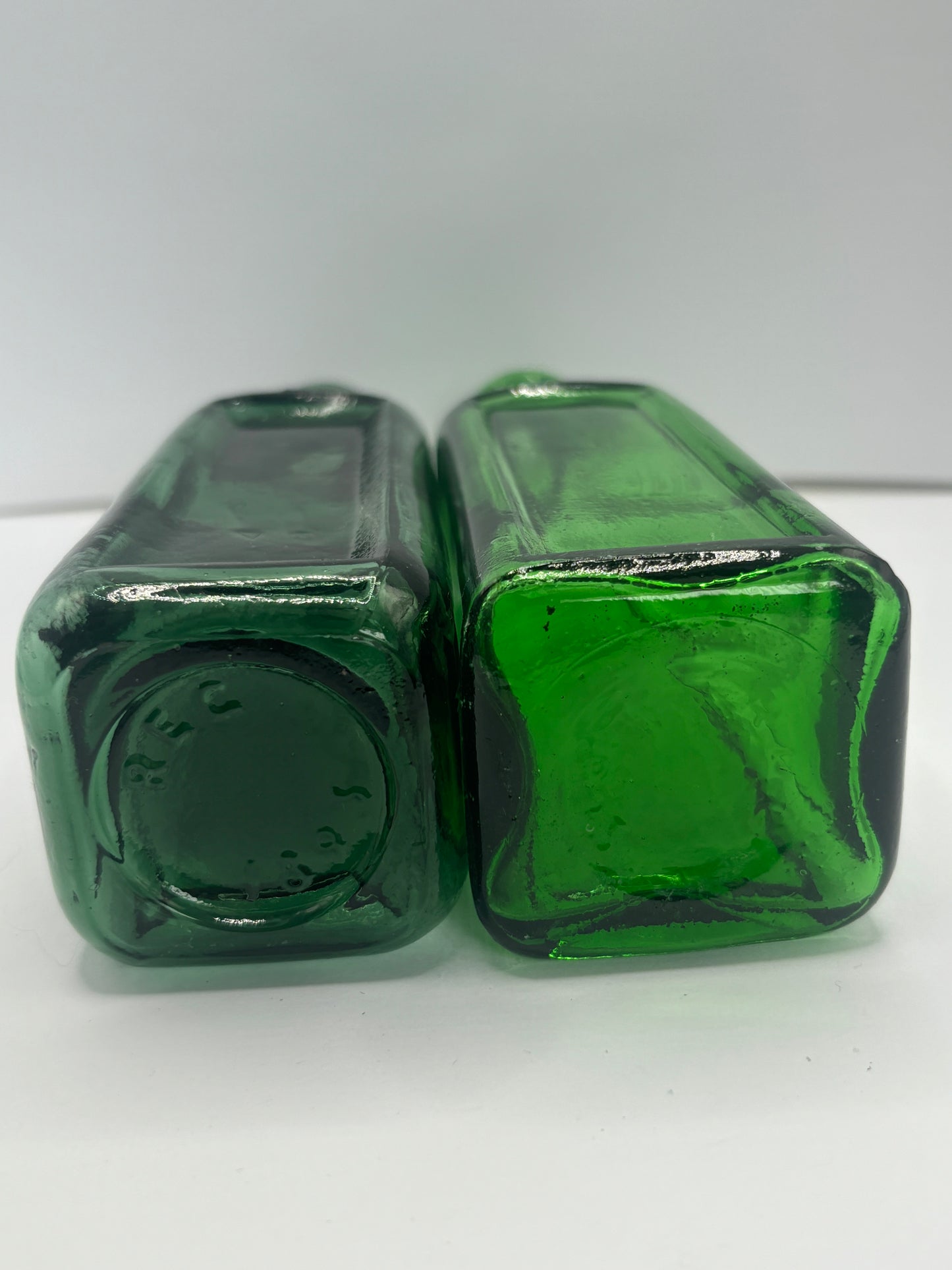 2 old green Izal bottles