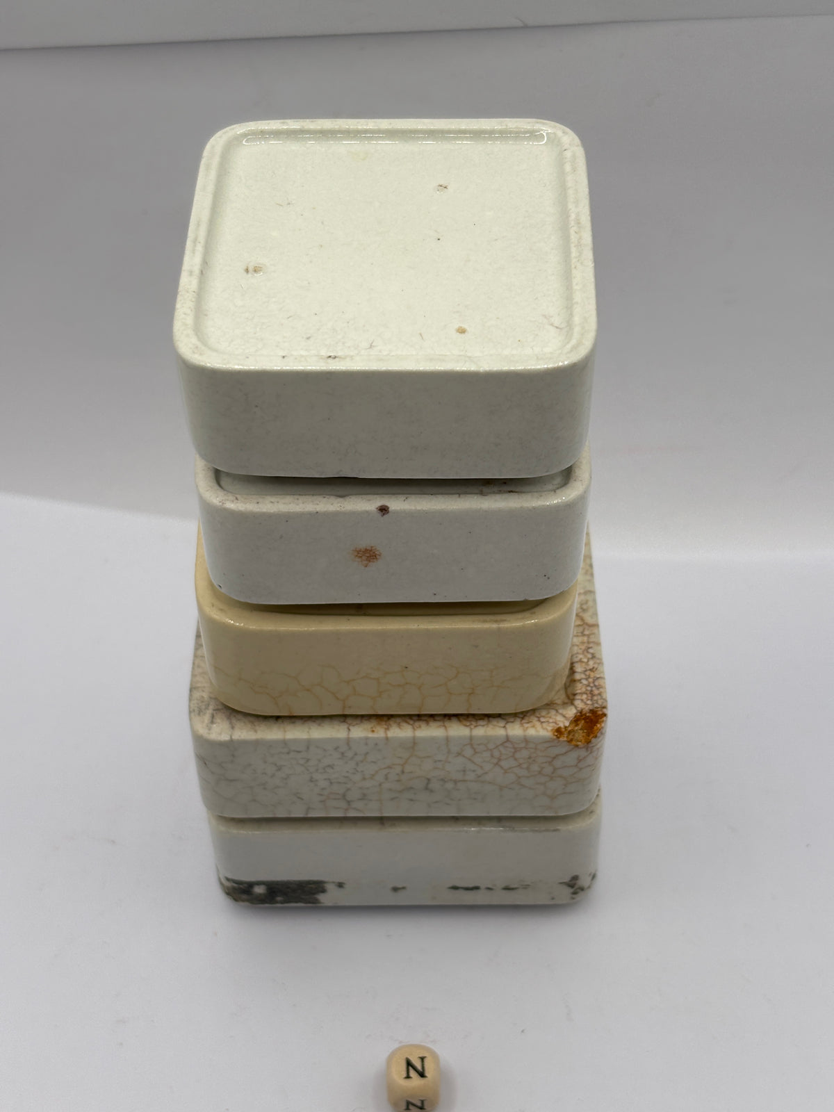 5 old square stoneware pot lid bases, stackers
