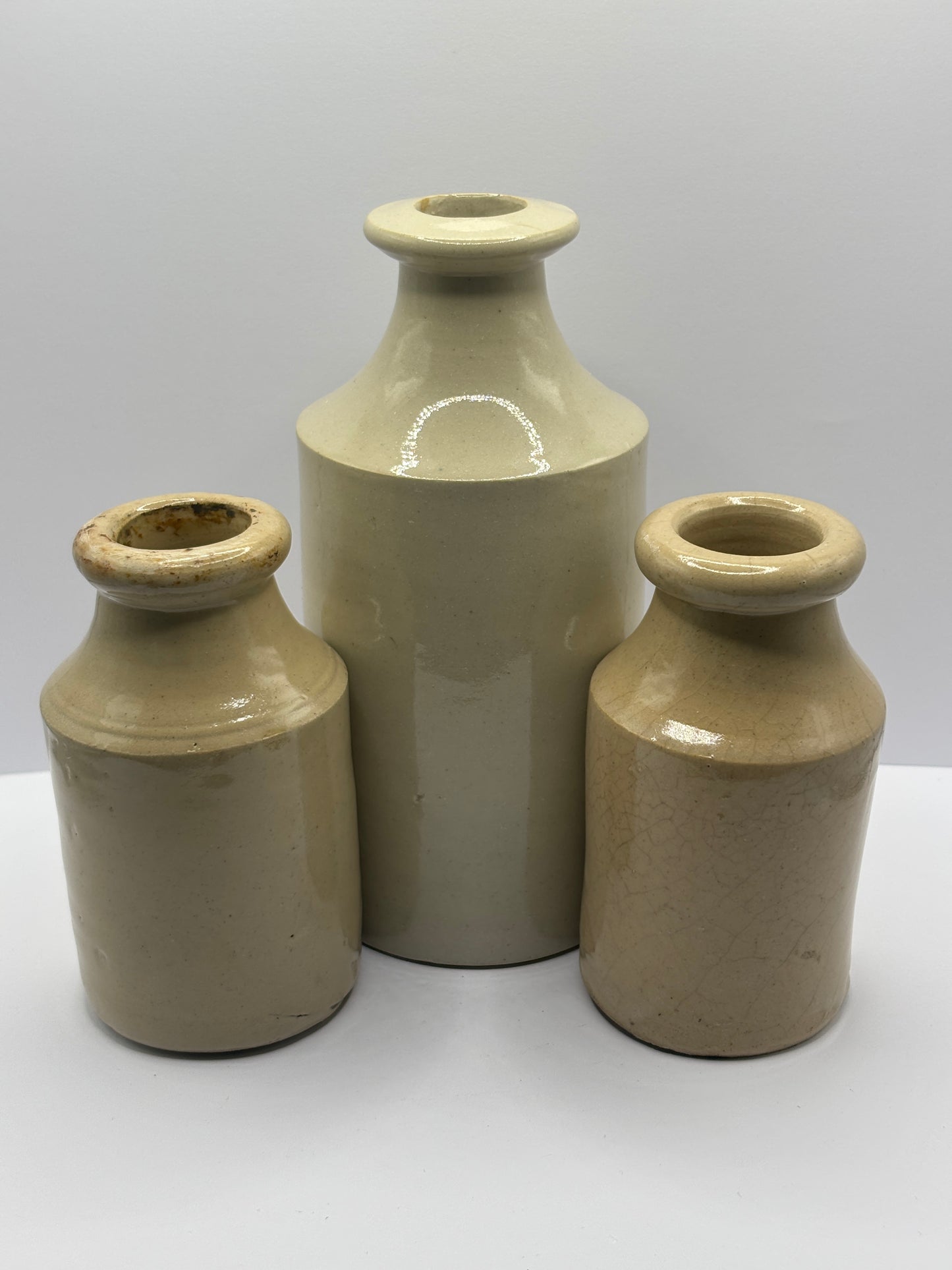 3 old stoneware furniture cream bottles, vase