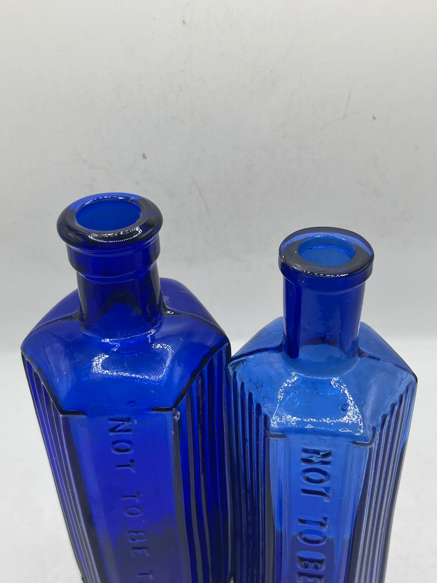 2 blue glass ribbed poison bottles, Not to be taken