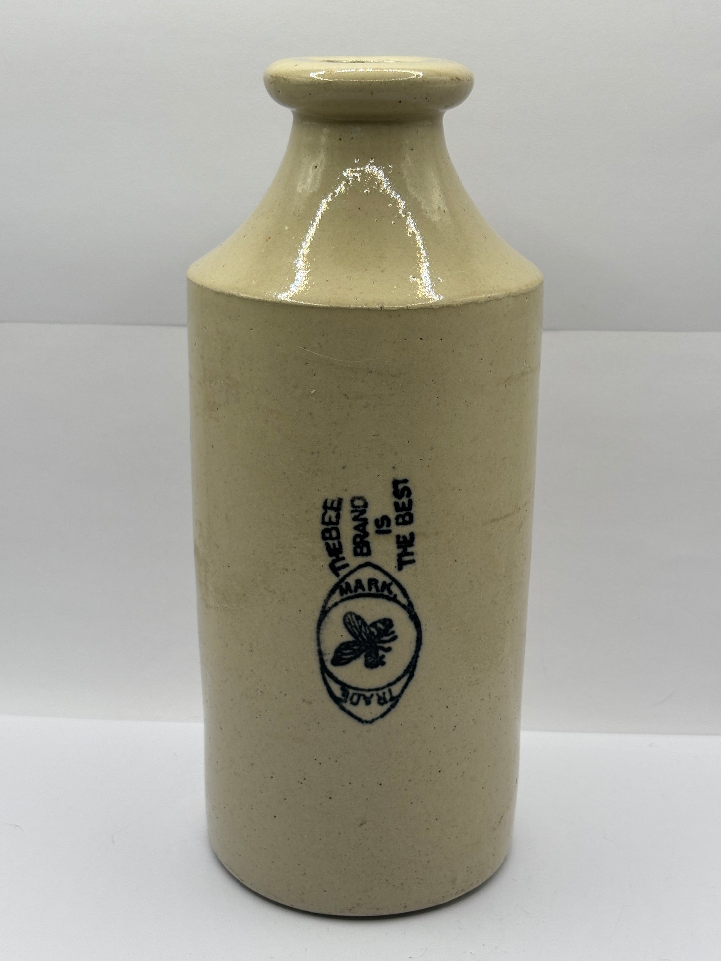 Old large advertising stoneware bottle. Bee brand