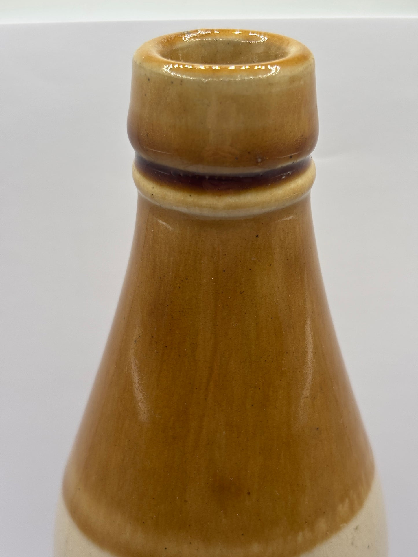 Old plain stoneware ginger beer bottle (a)