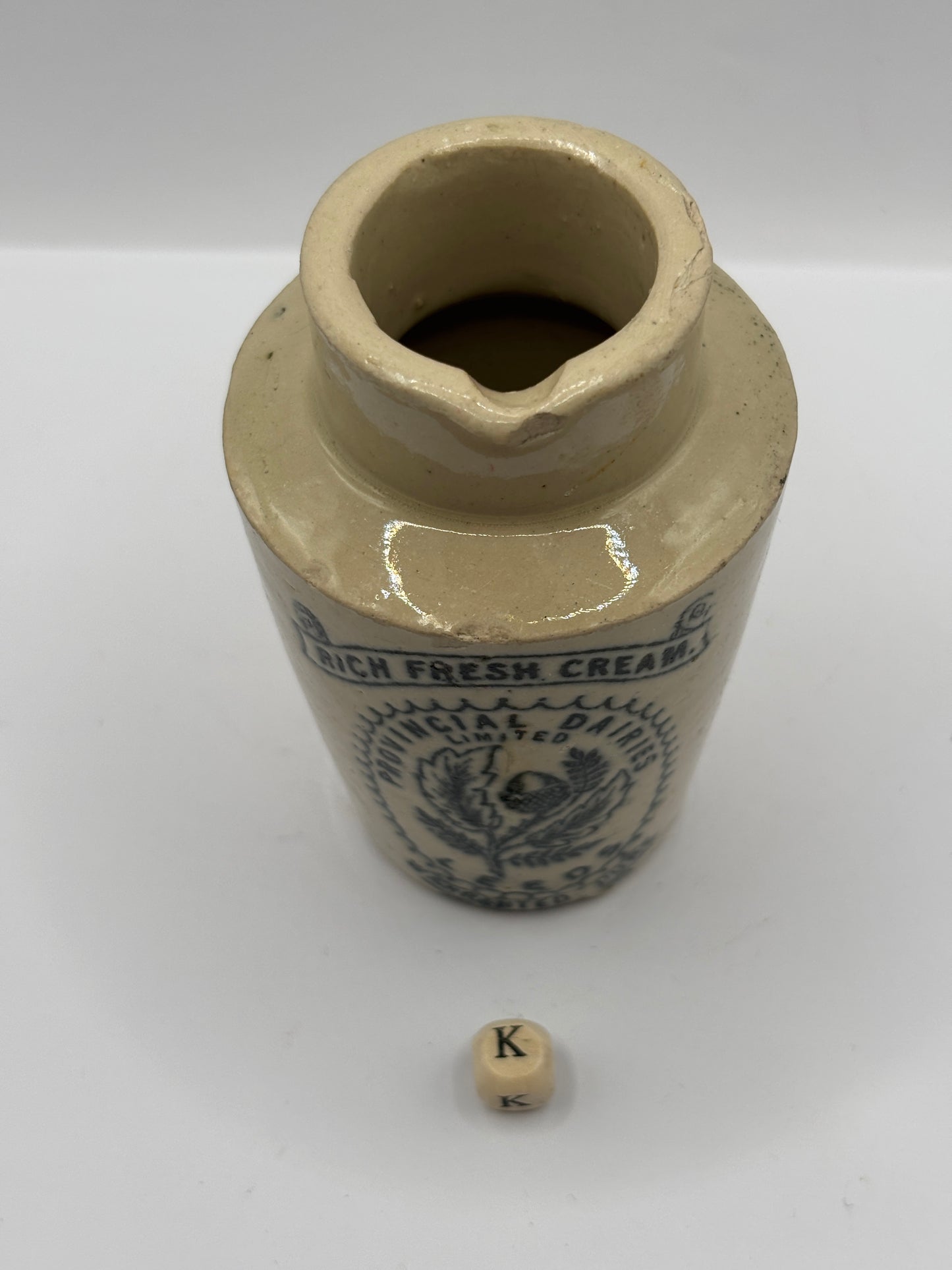 Old stoneware advertising cream pot. Provencial dairies Leeds (k) damaged