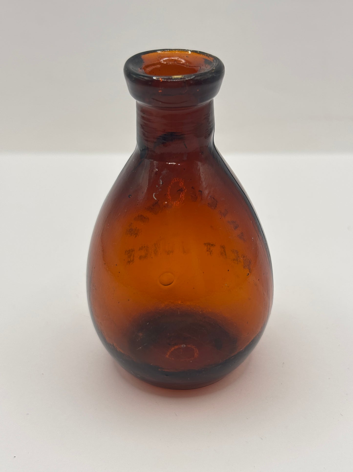 Old amber glass bottle, valentines meat juice
