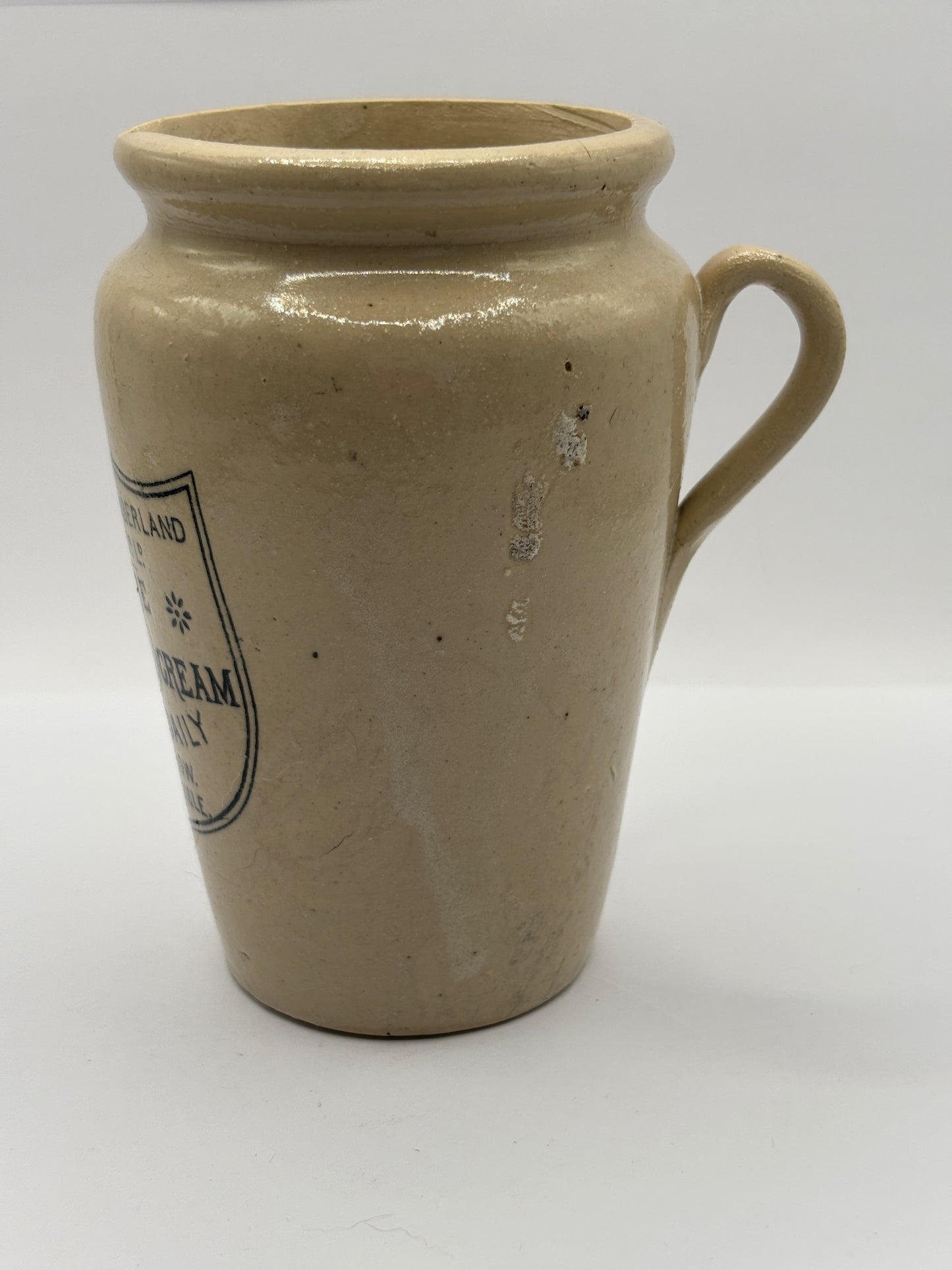 Old large advertising cream pot, Carricks pure thick cream with handle. Black print 11.5cms