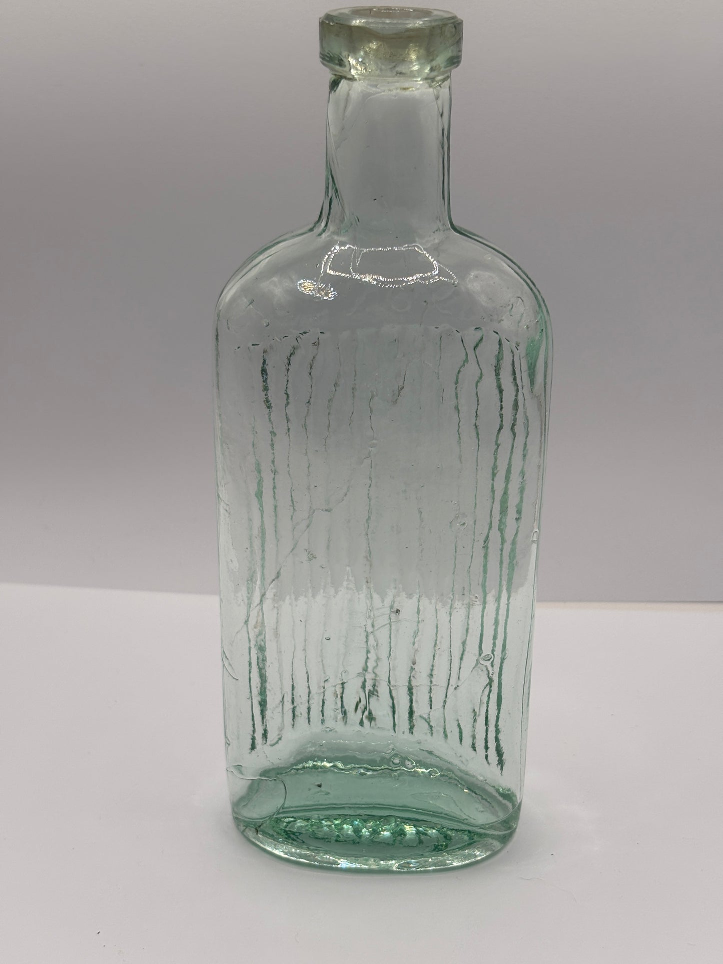 Old aqua glass poison bottle, Poisonous