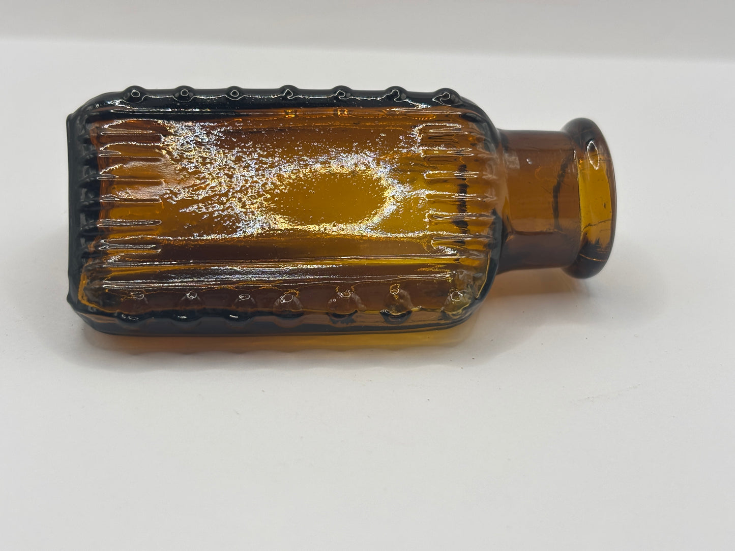 Old amber glass poison bottle