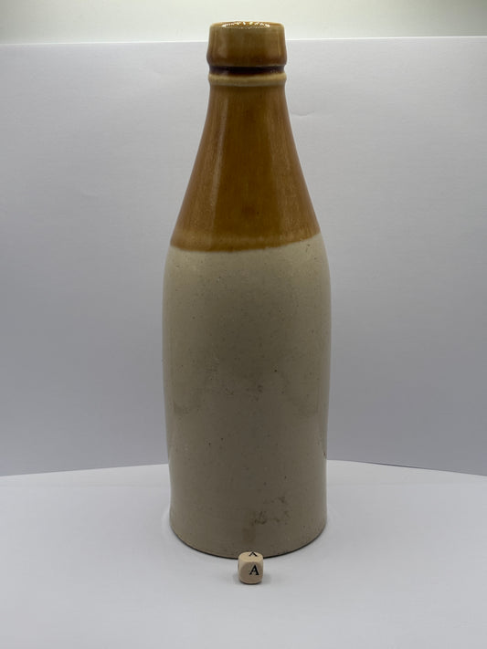 Old plain stoneware ginger beer bottle (a)
