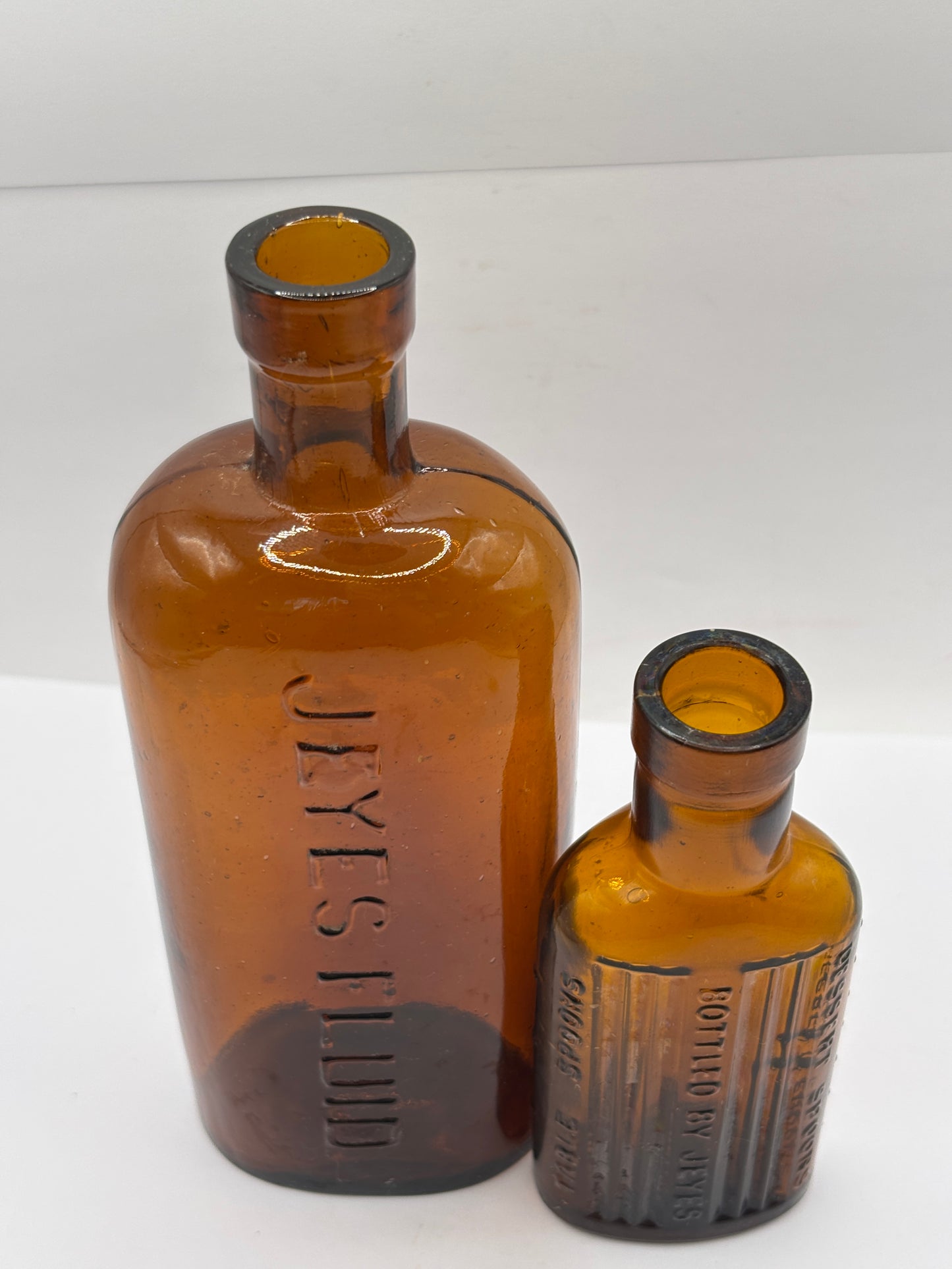 2 Old amber glass Jeyes fluid bottles