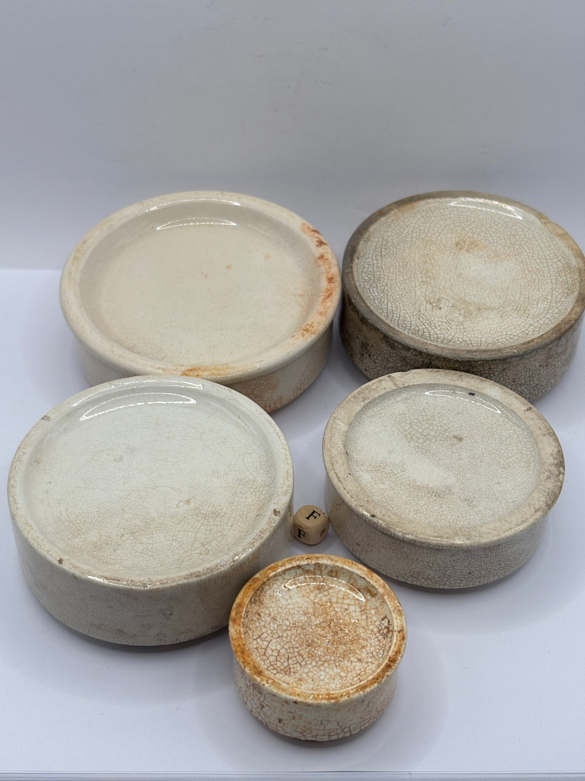 5 old stoneware pot lid bases, stackers (F)