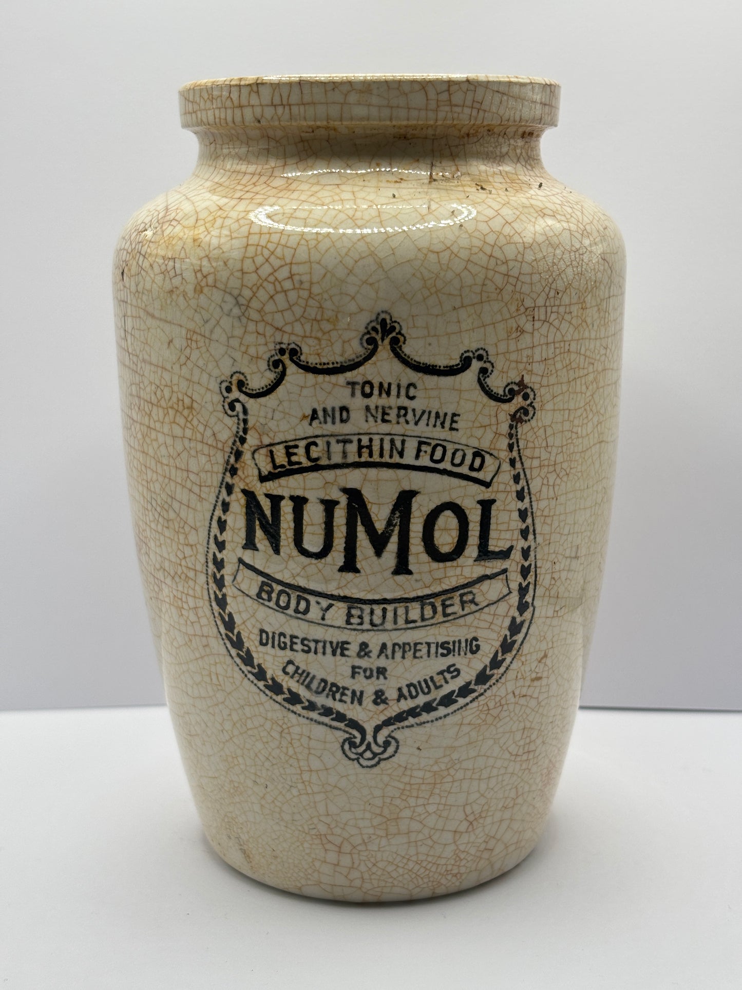 Old stained & crazed numol body builder advertising jar, 14cms