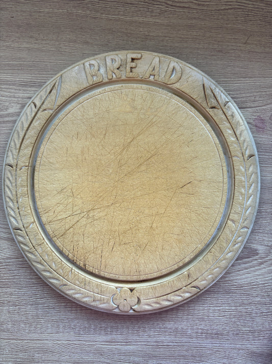 Old wooden carved bread board