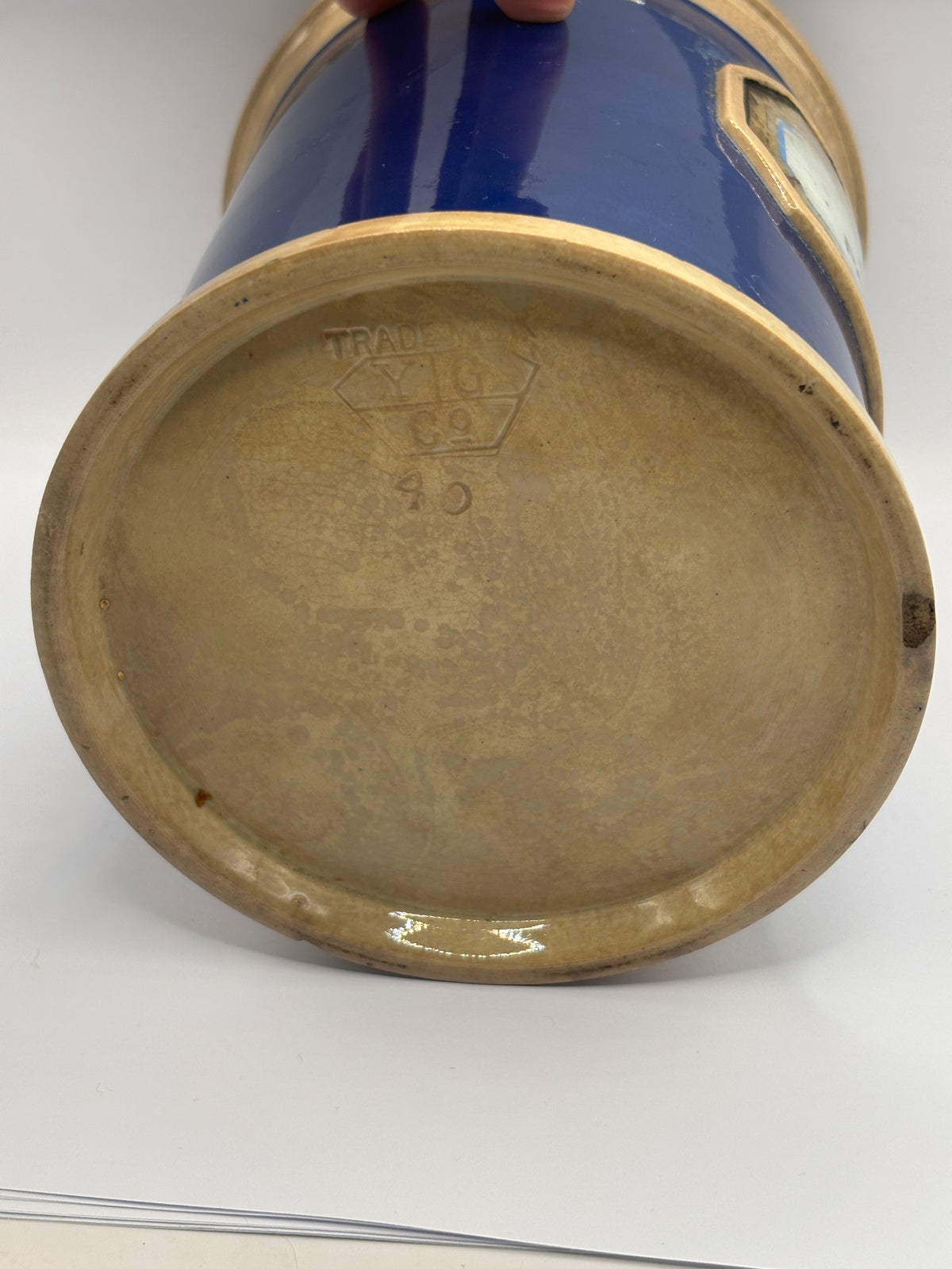 Old plain blue stoneware apothecary jar with glass label
