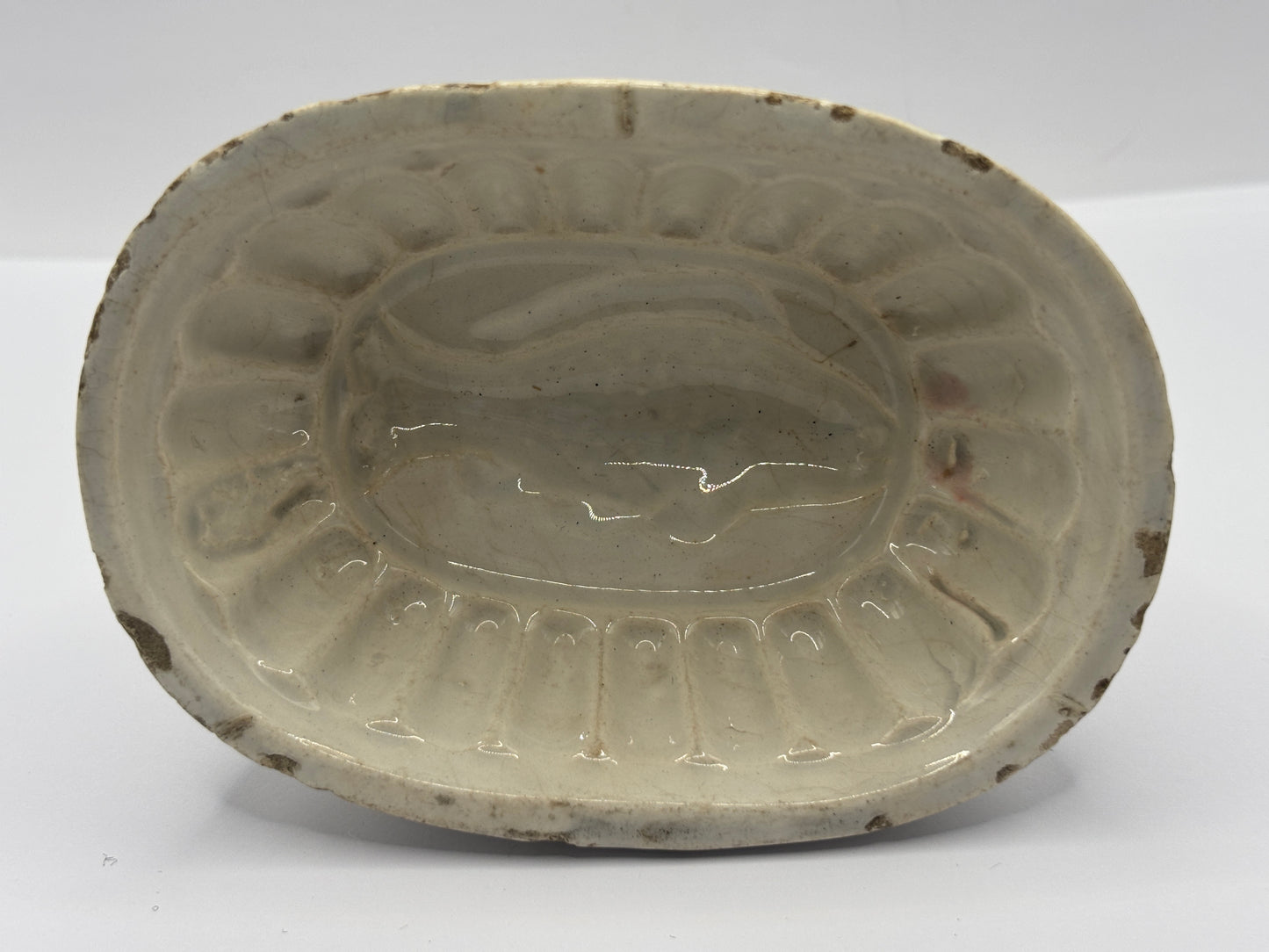 Old mini white stoneware jelly mould, fish design