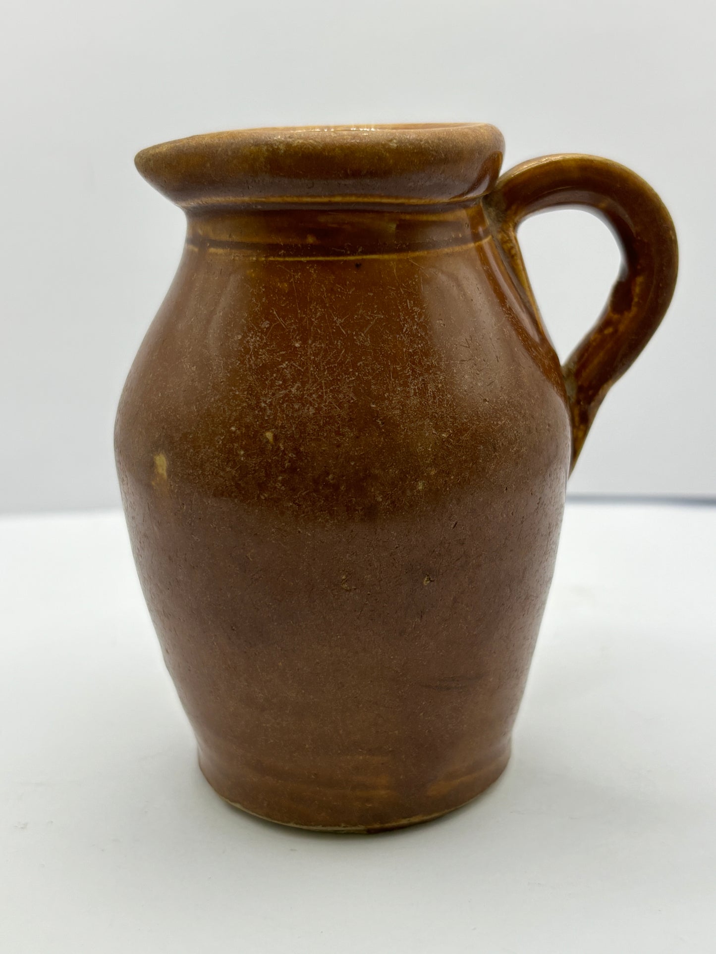 Old stoneware shop display cream pot. Turners cream Disley.