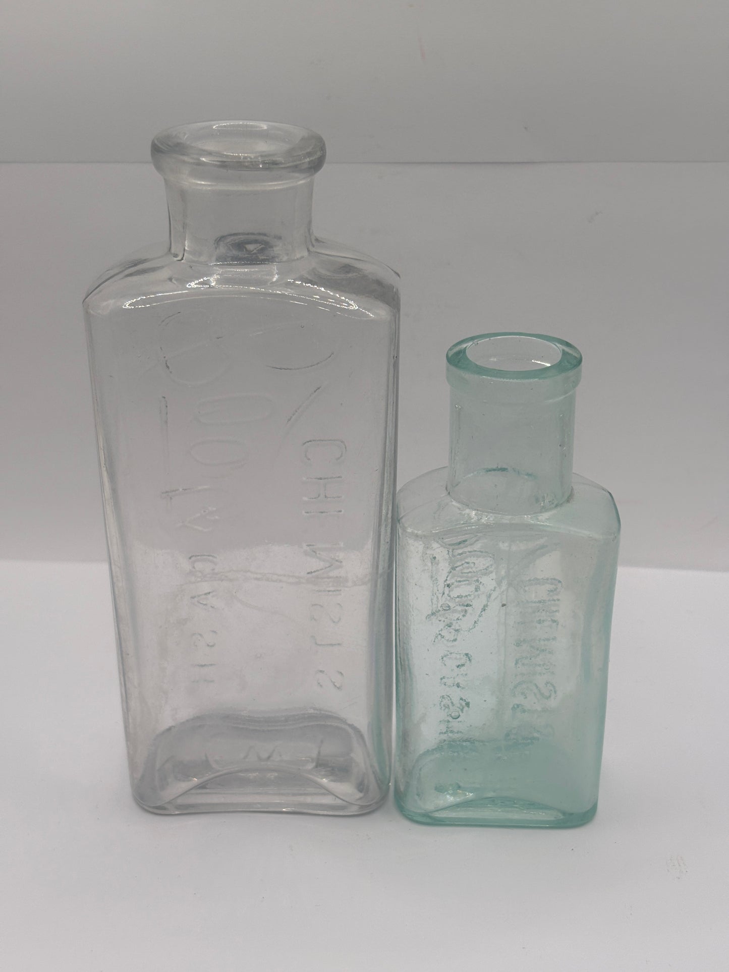 2 Old glass Boots cash chemists bottles