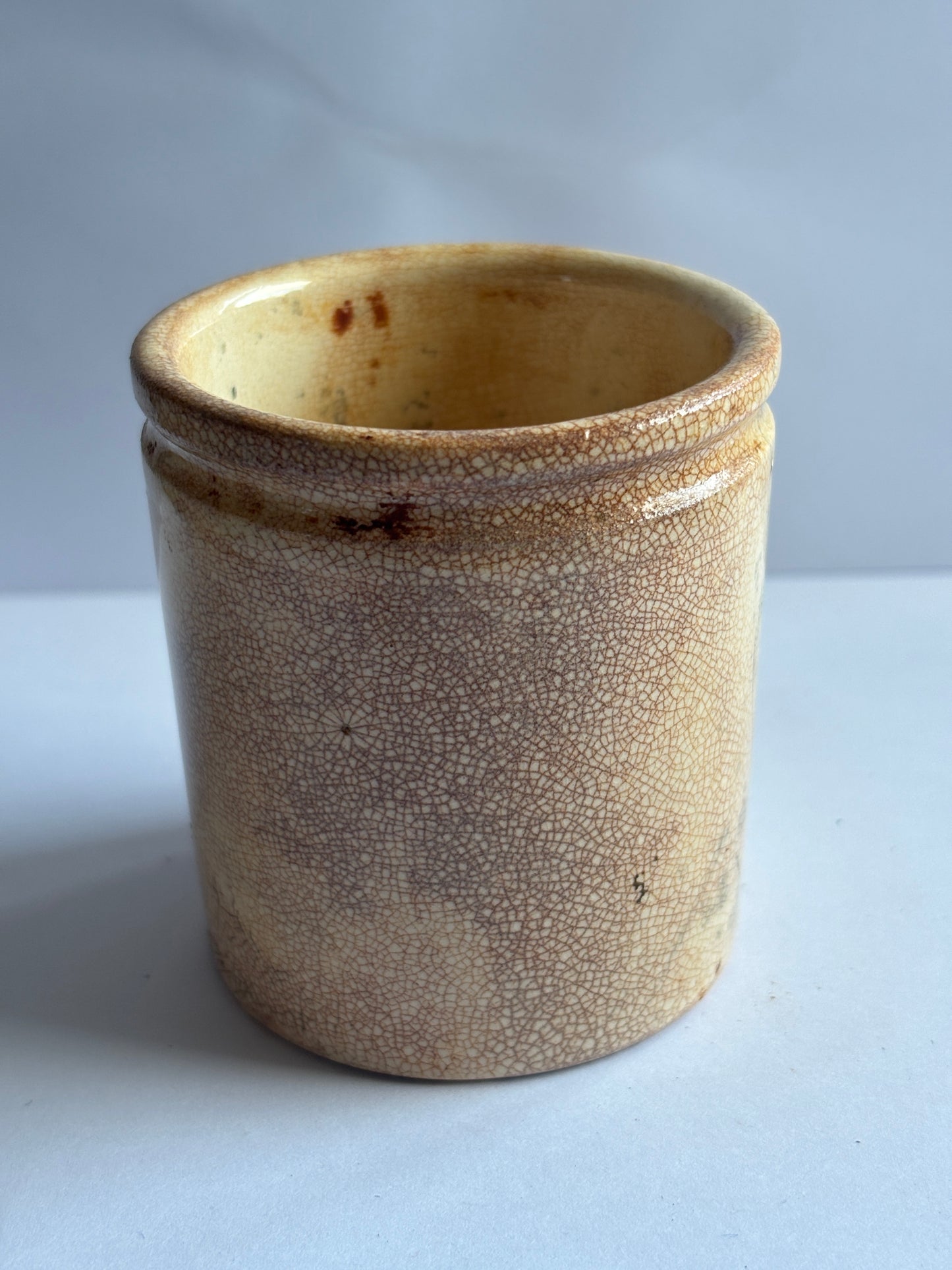 Old white stoneware pot, stained & crazed