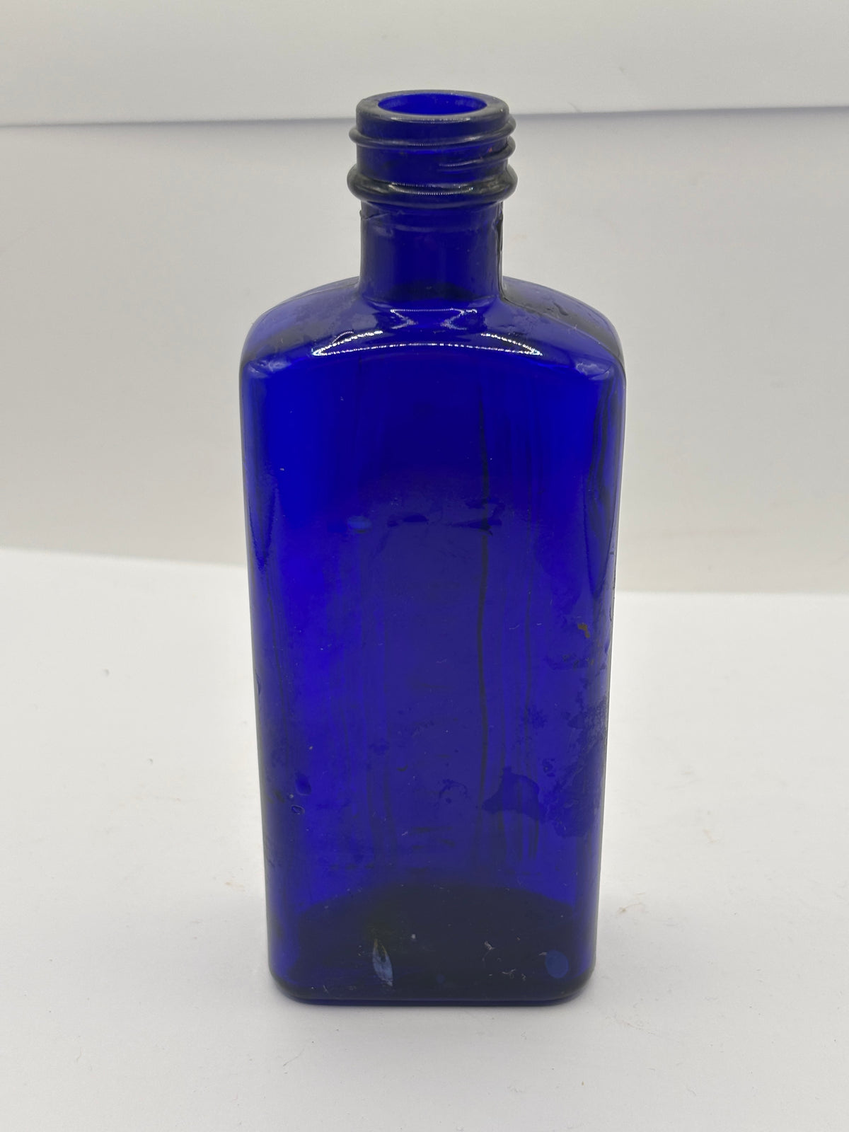 old blue glass ribbed poison bottle, not to be taken