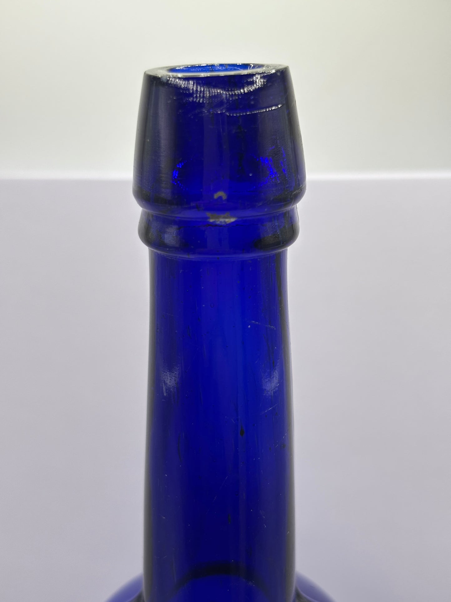 Tall blue castor oil bottle 24cms