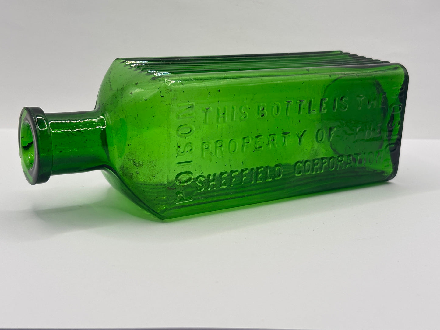 Old green glass poison bottle, Sheffield corporation poison bottle. Chipped