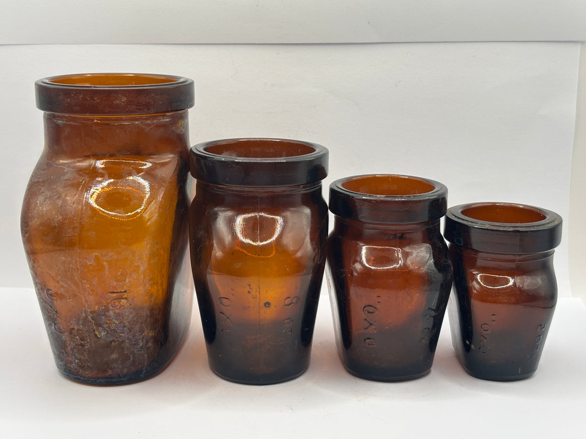 Set of 4 old amber glass OXO bottles. 16oz- 2oz